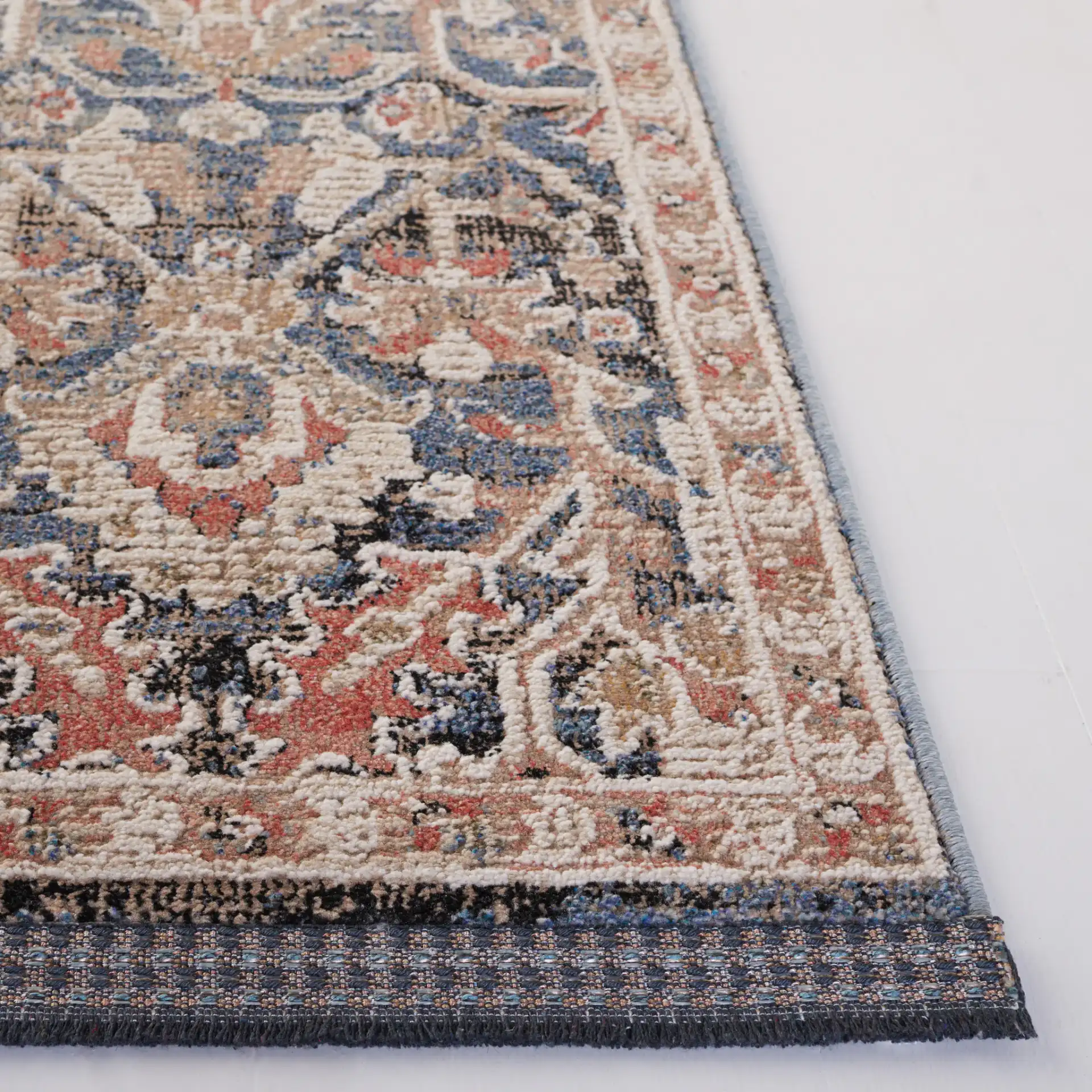 Vivaldi Distressed Floral Rug in Blue / Ivory in a styled room