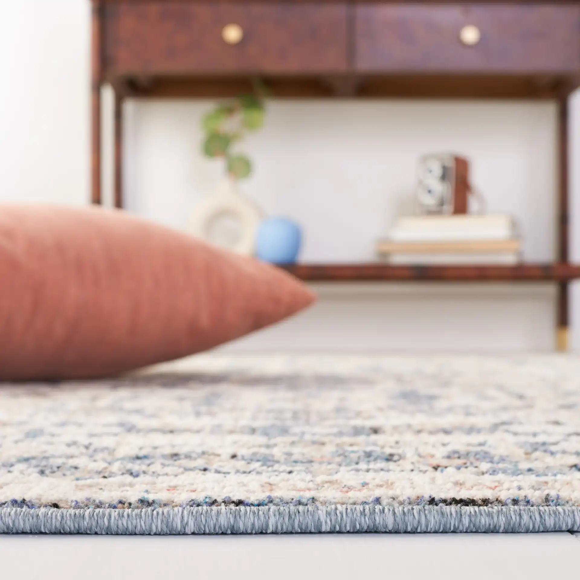 Vivaldi Distressed Floral Rug in Blue / Ivory in a styled room