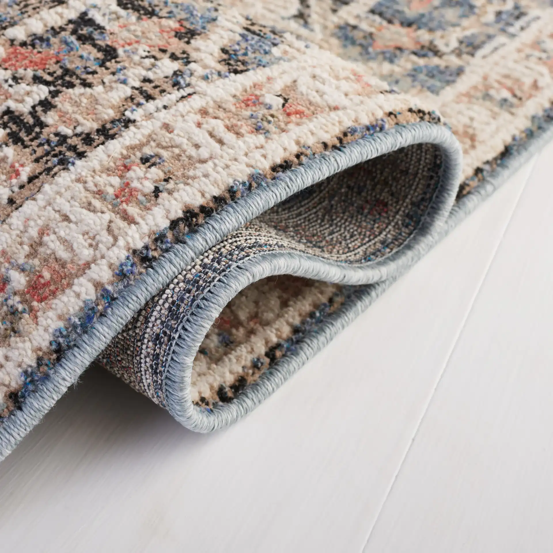 Vivaldi Distressed Floral Rug in Blue / Ivory in a styled room