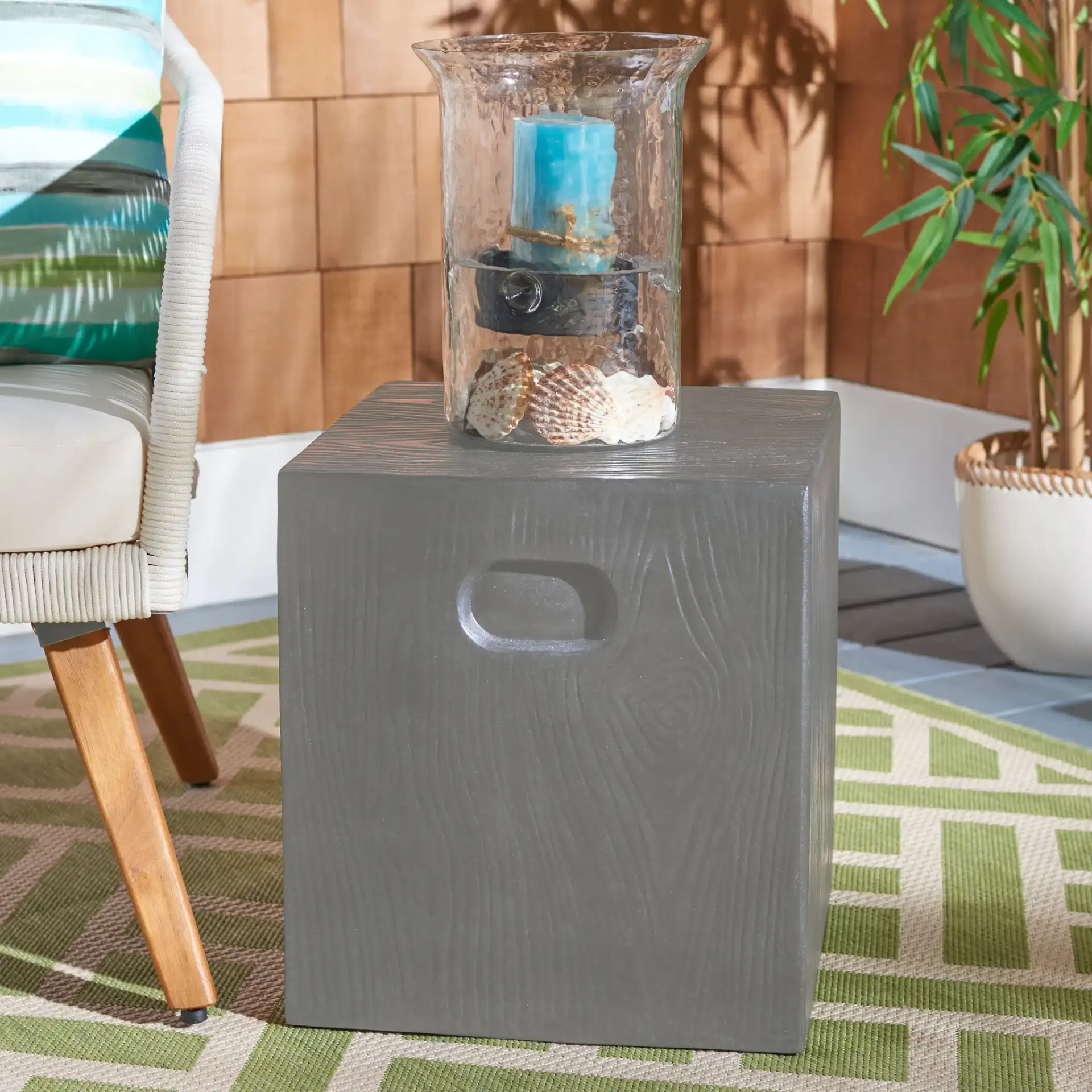 Cube Indoor/Outdoor Accent Stool in Dark Gray in a styled room