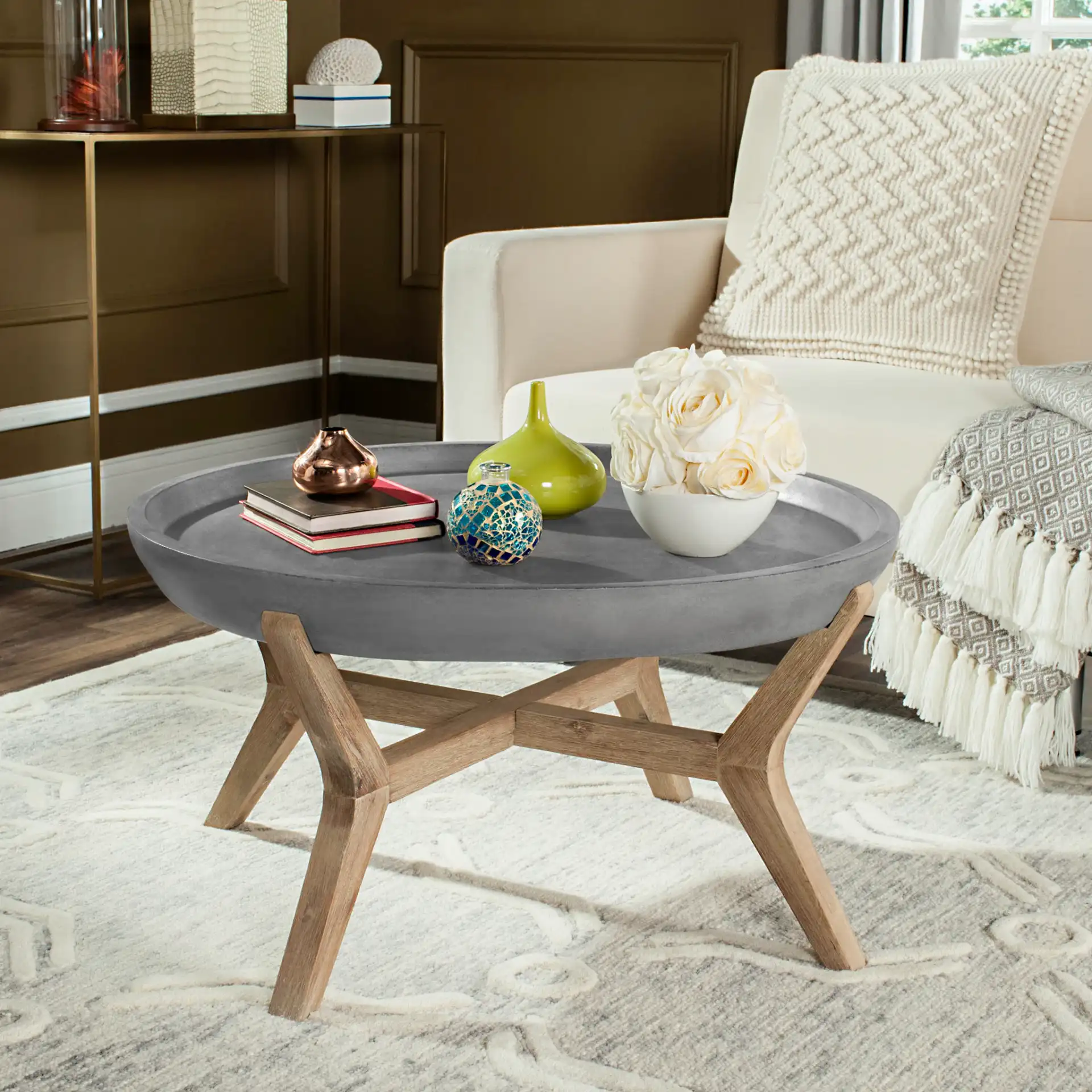 Wynn Indoor/Outdoor Coffee Table in Dark Gray in a styled room