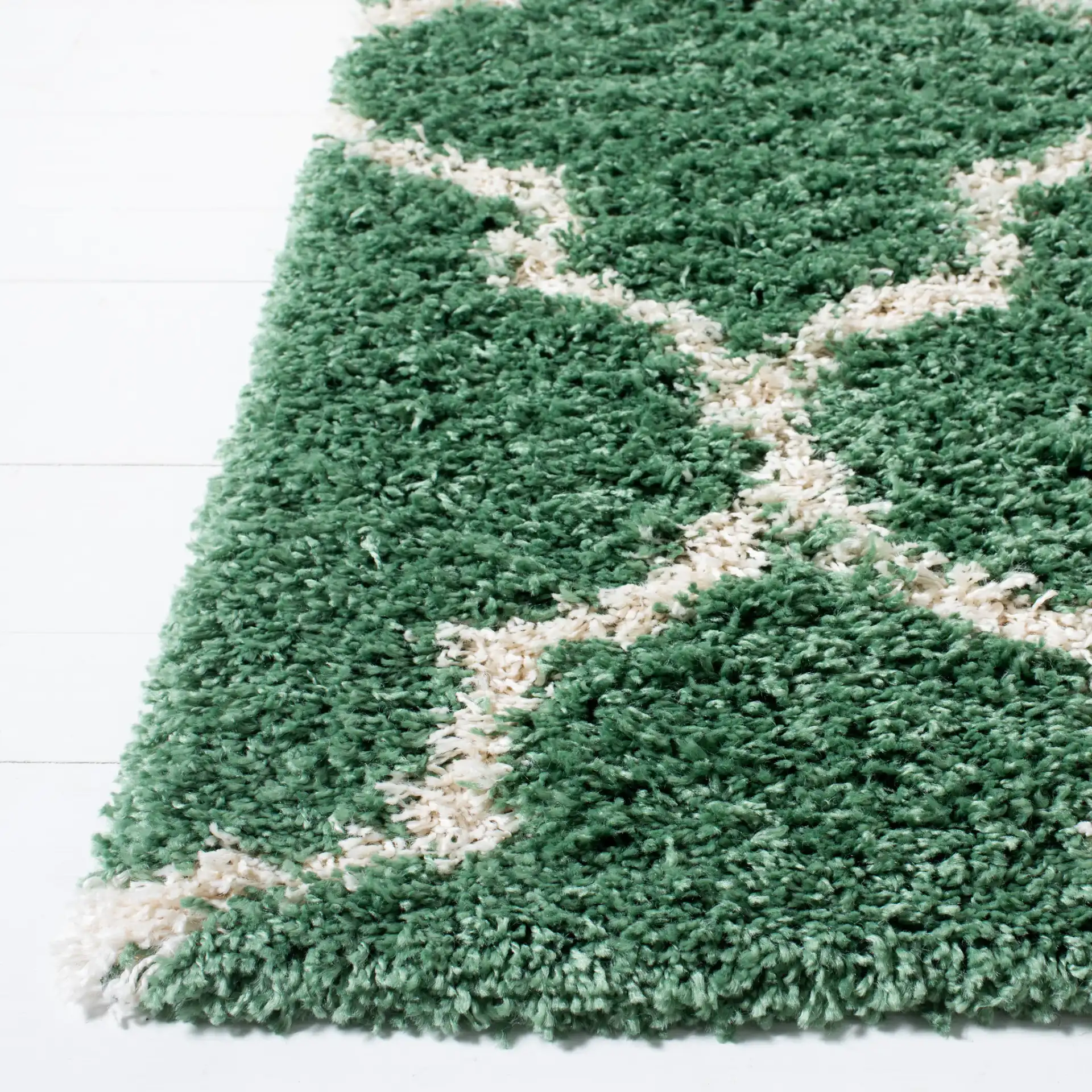 Venus Ogee Trellis Shag Rug in Green / Ivory in a styled room
