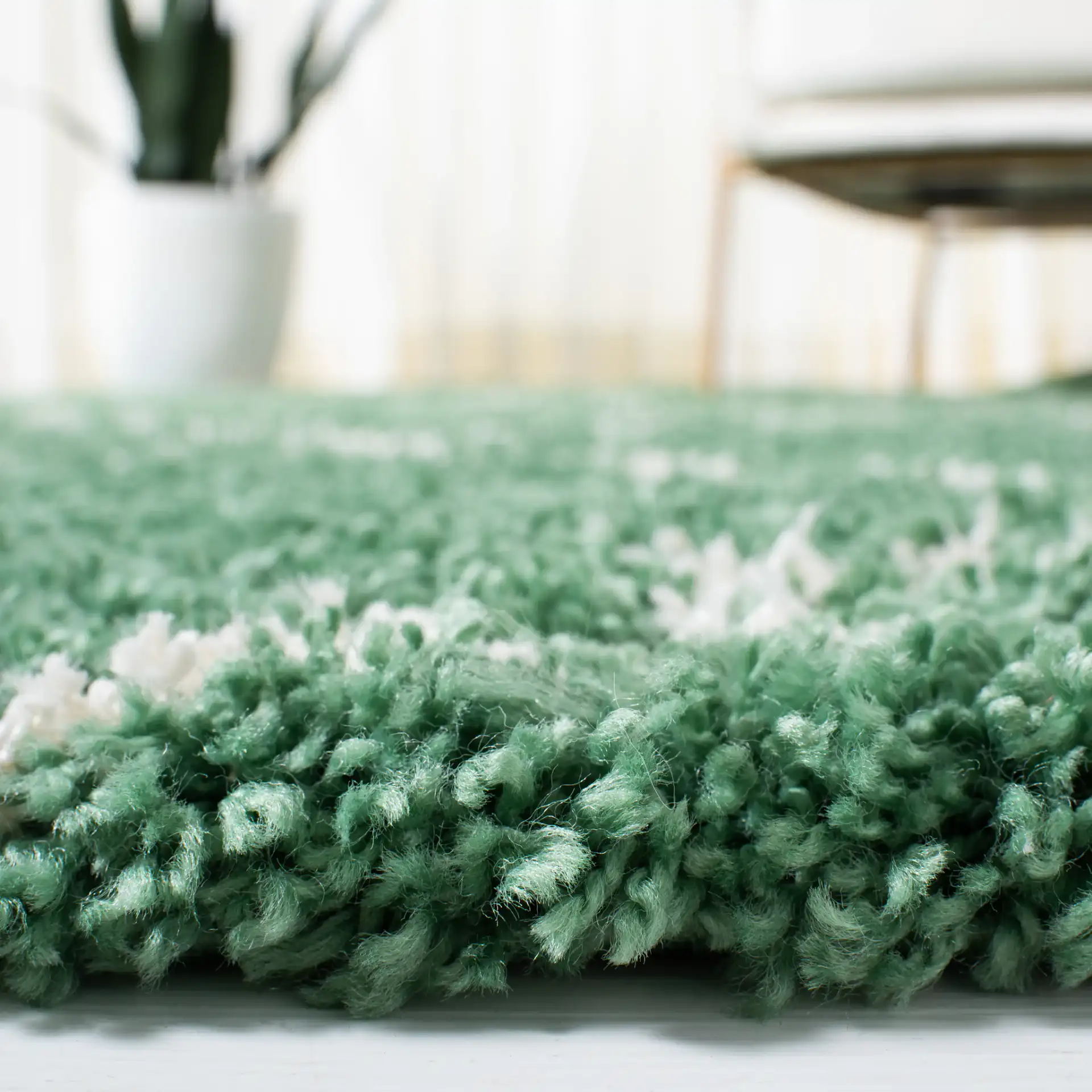 Venus Ogee Trellis Shag Rug in Green / Ivory in a styled room