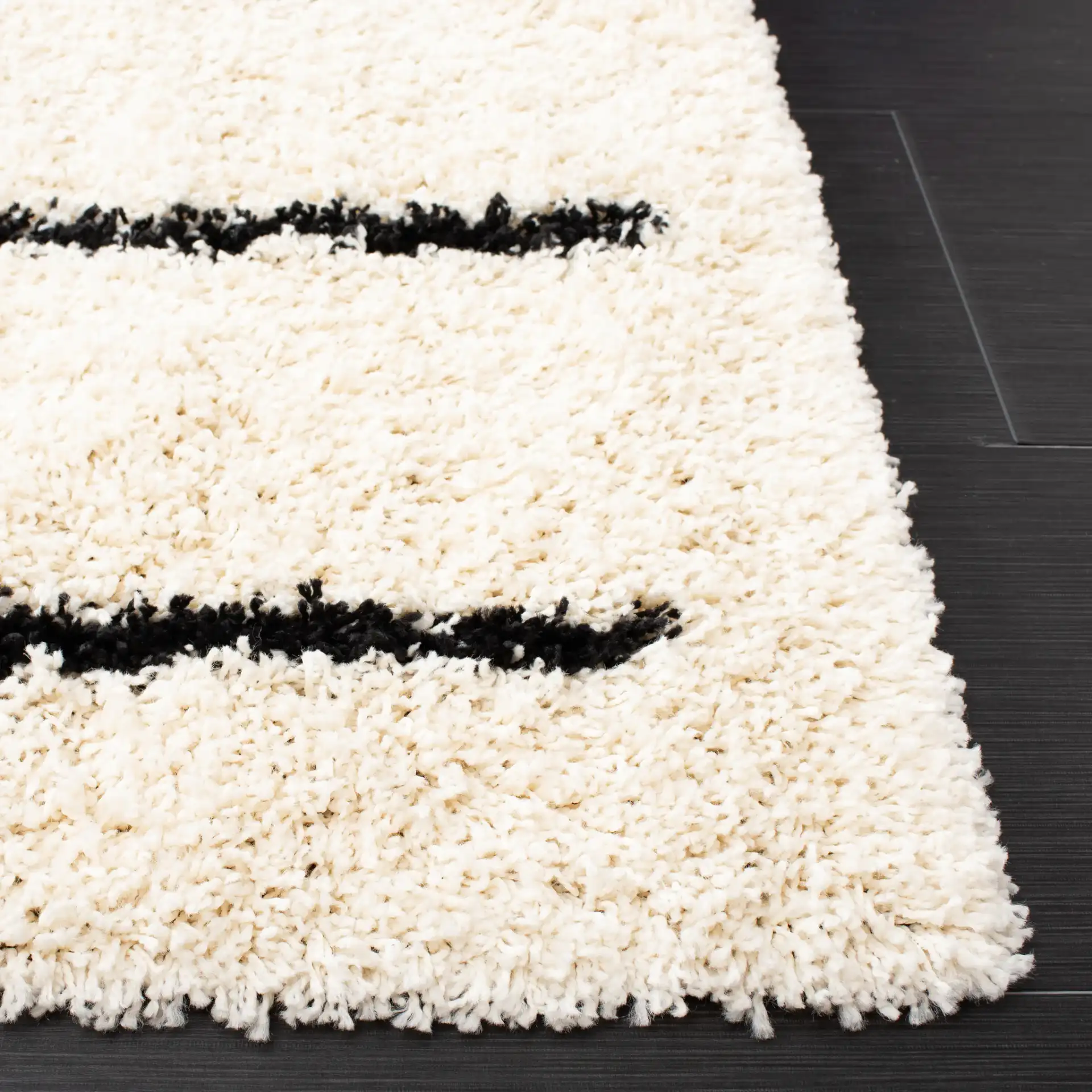 Venus Striped Shag Rug in Ivory / Black in a styled room