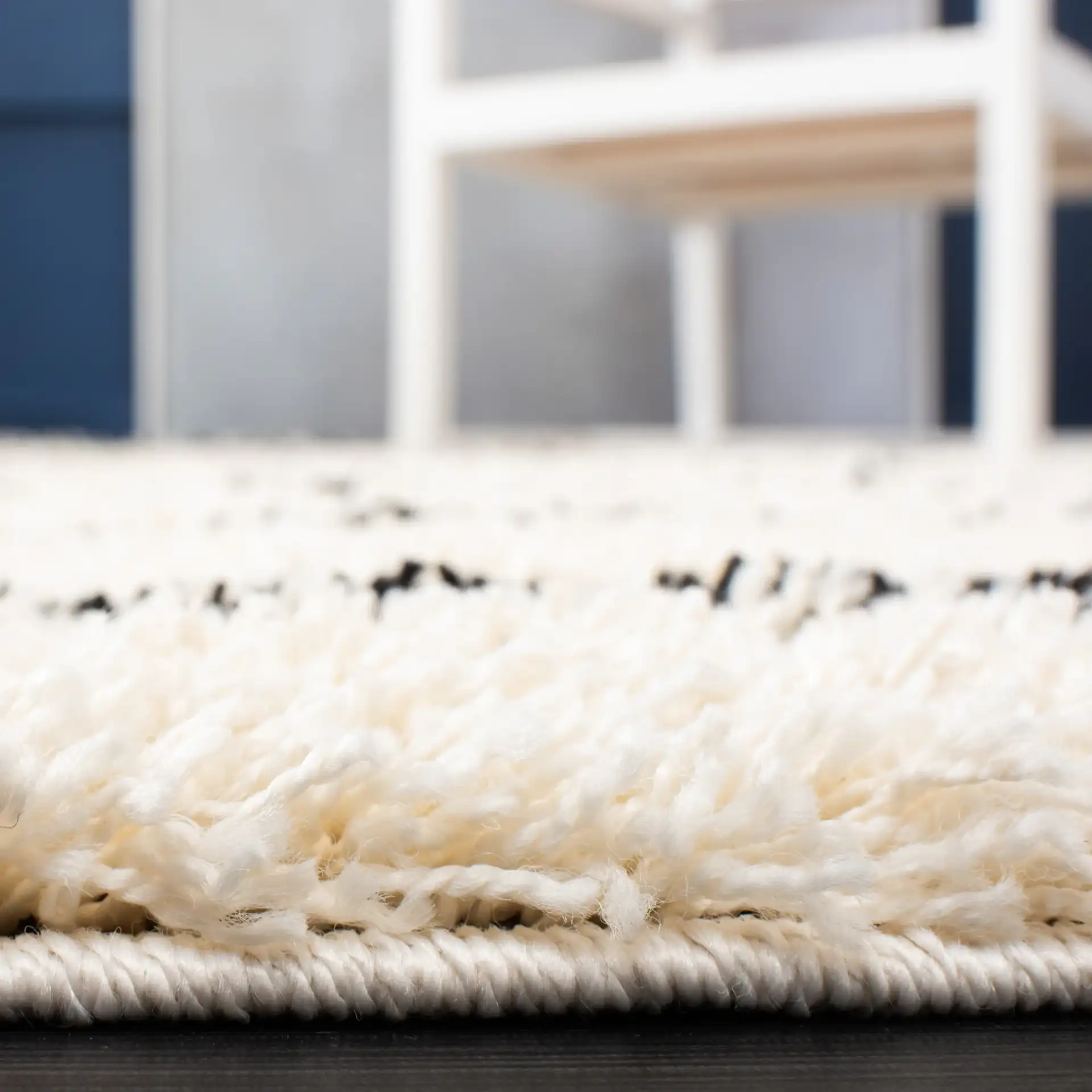 Venus Striped Shag Rug in Ivory / Black in a styled room