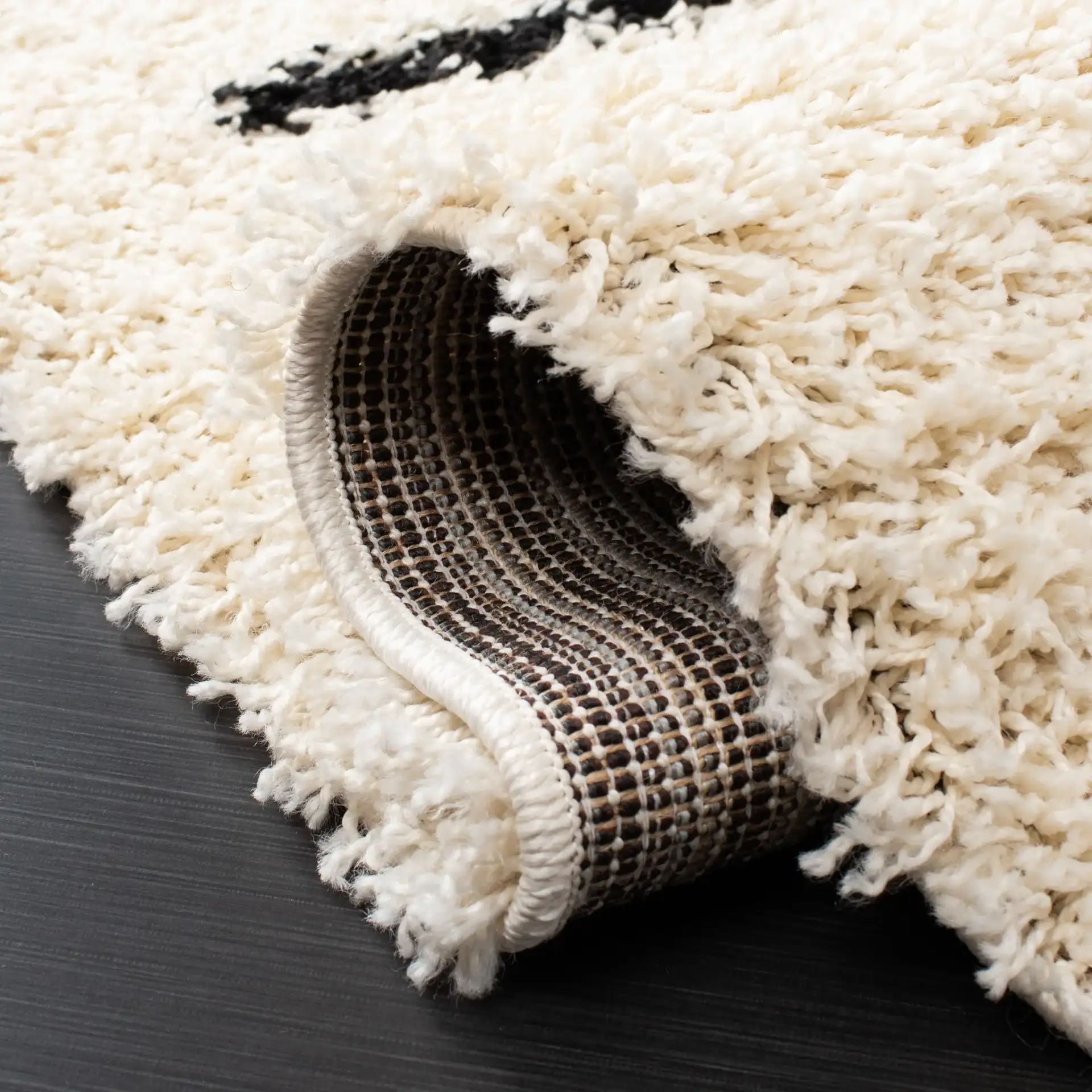 Venus Striped Shag Rug in Ivory / Black in a styled room