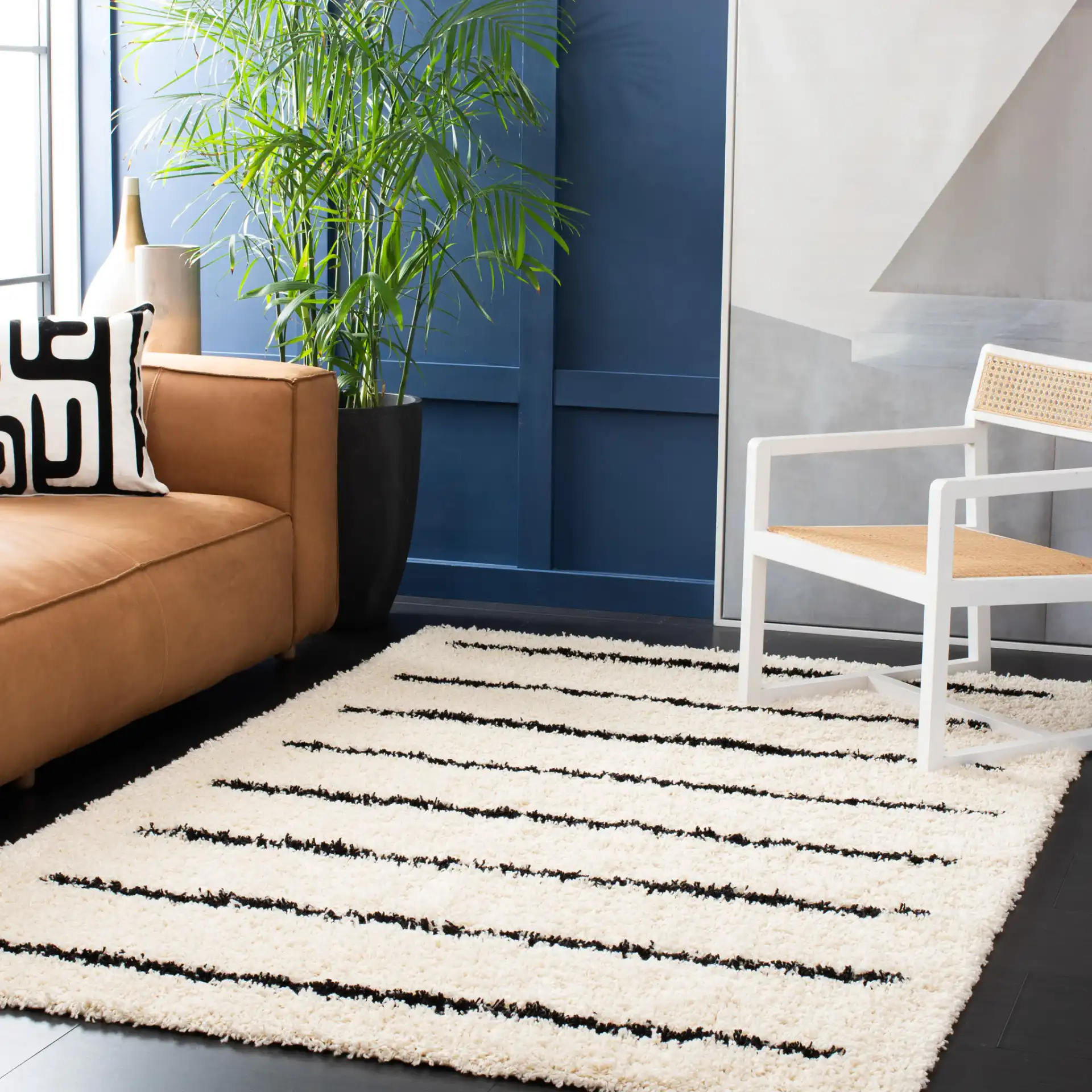 Venus Striped Shag Rug in Ivory / Black in a styled room