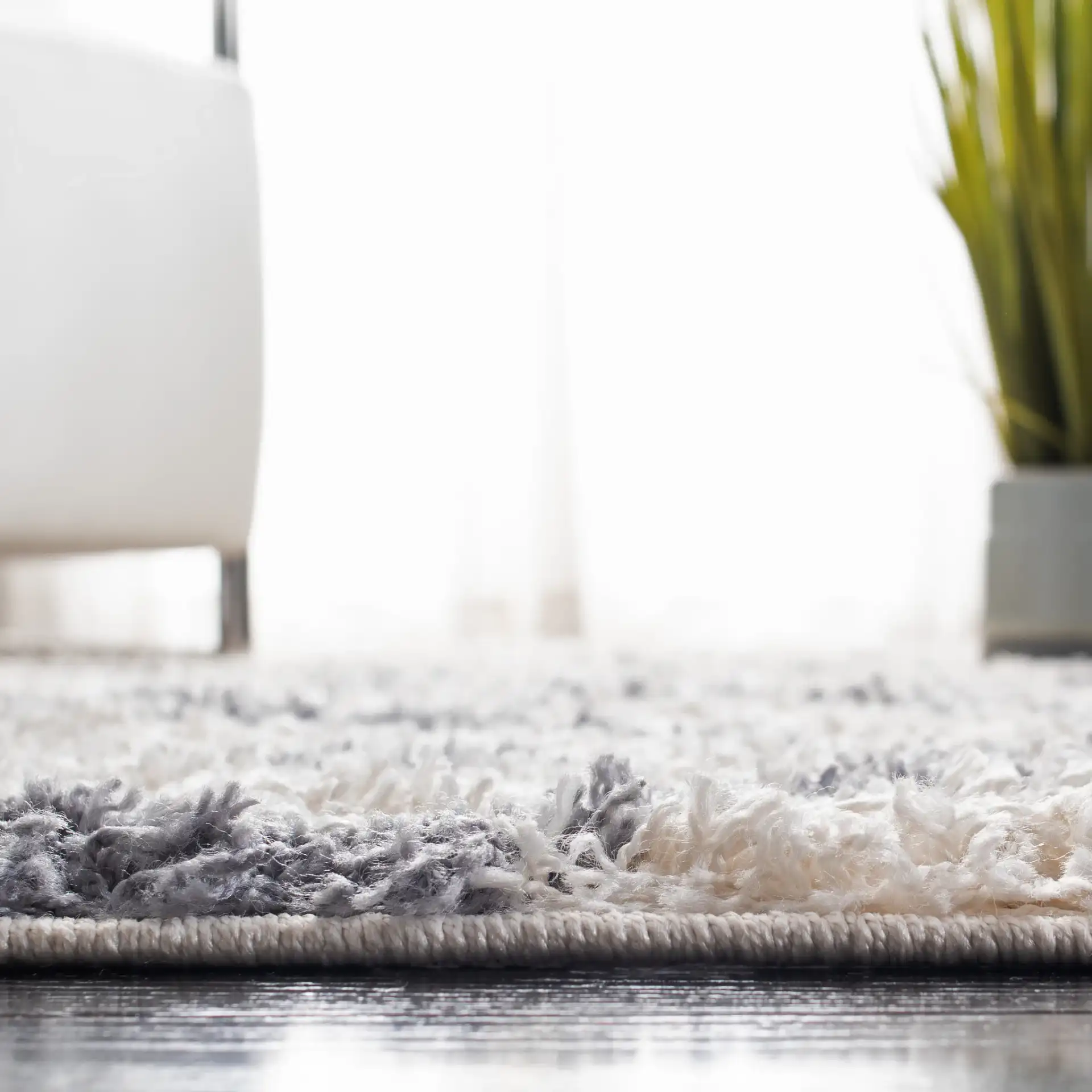 Venus Diamond Lattice Shag Rug in Ivory / Gray in a styled room