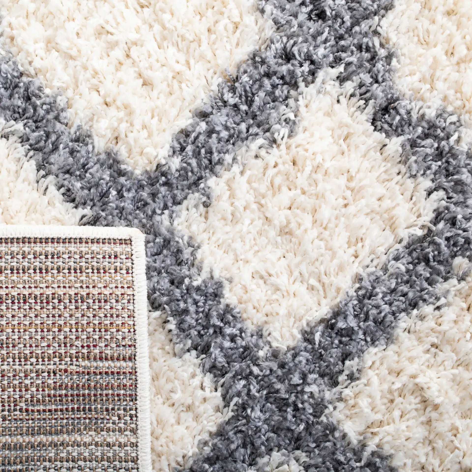 Venus Diamond Lattice Shag Rug in Ivory / Gray in a styled room