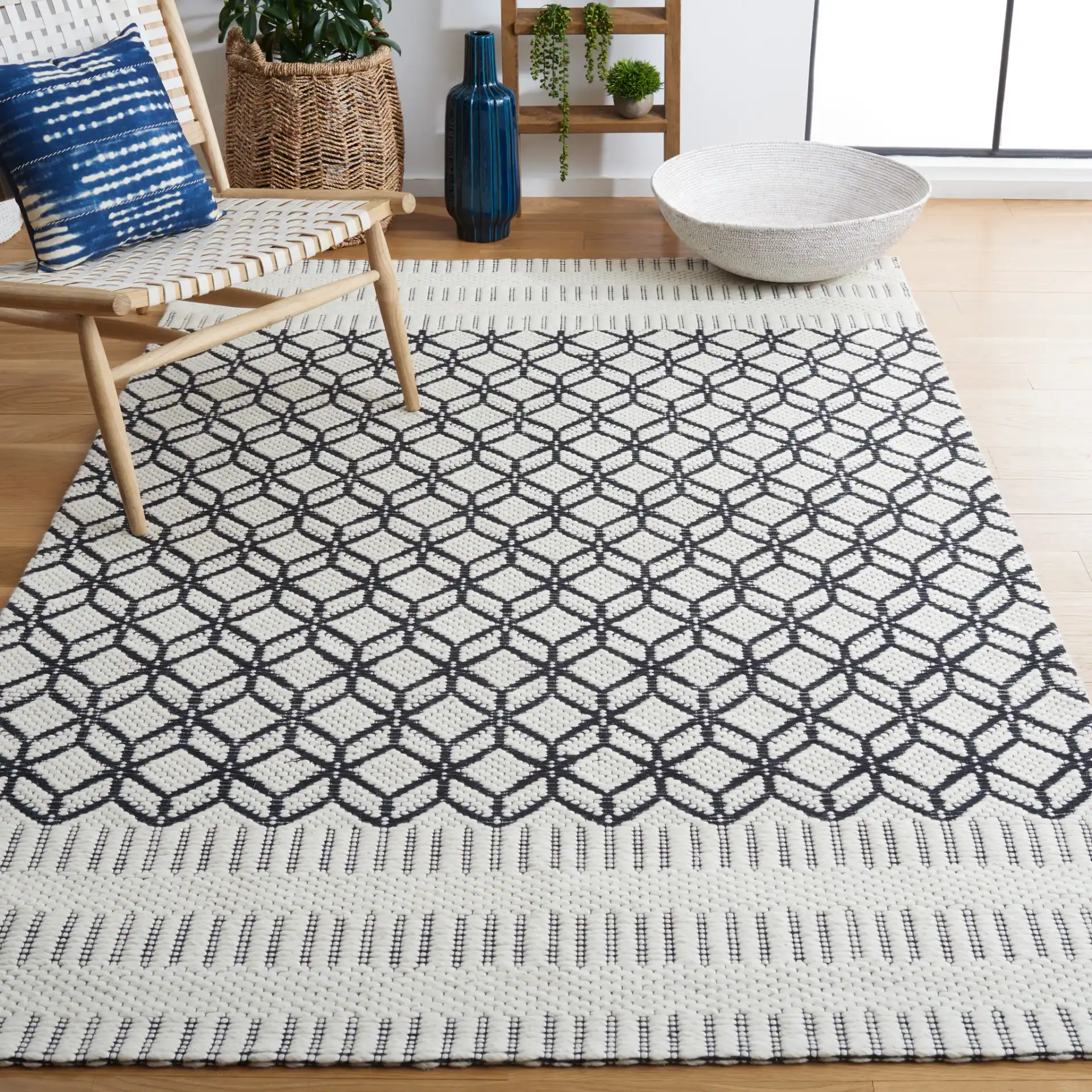 Vermont Stacked Diamond Trellis Hand-Woven Wool Rug in Ivory / Black in a styled room