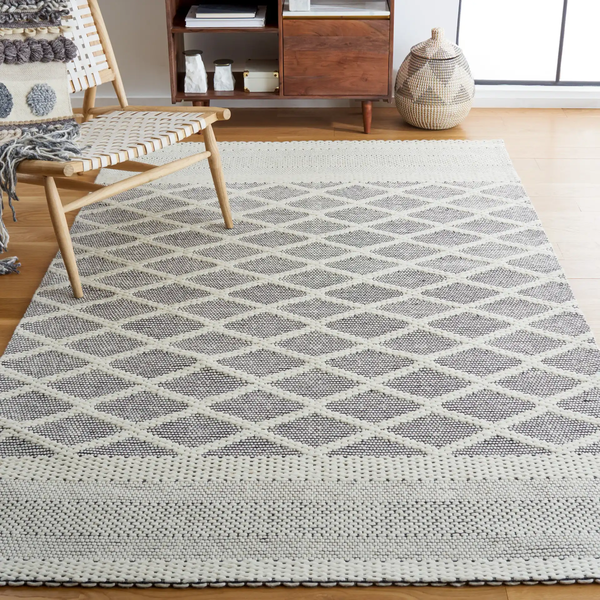 Vermont Lattice Band Hand-Woven Wool Rug in Ivory / Black in a styled room