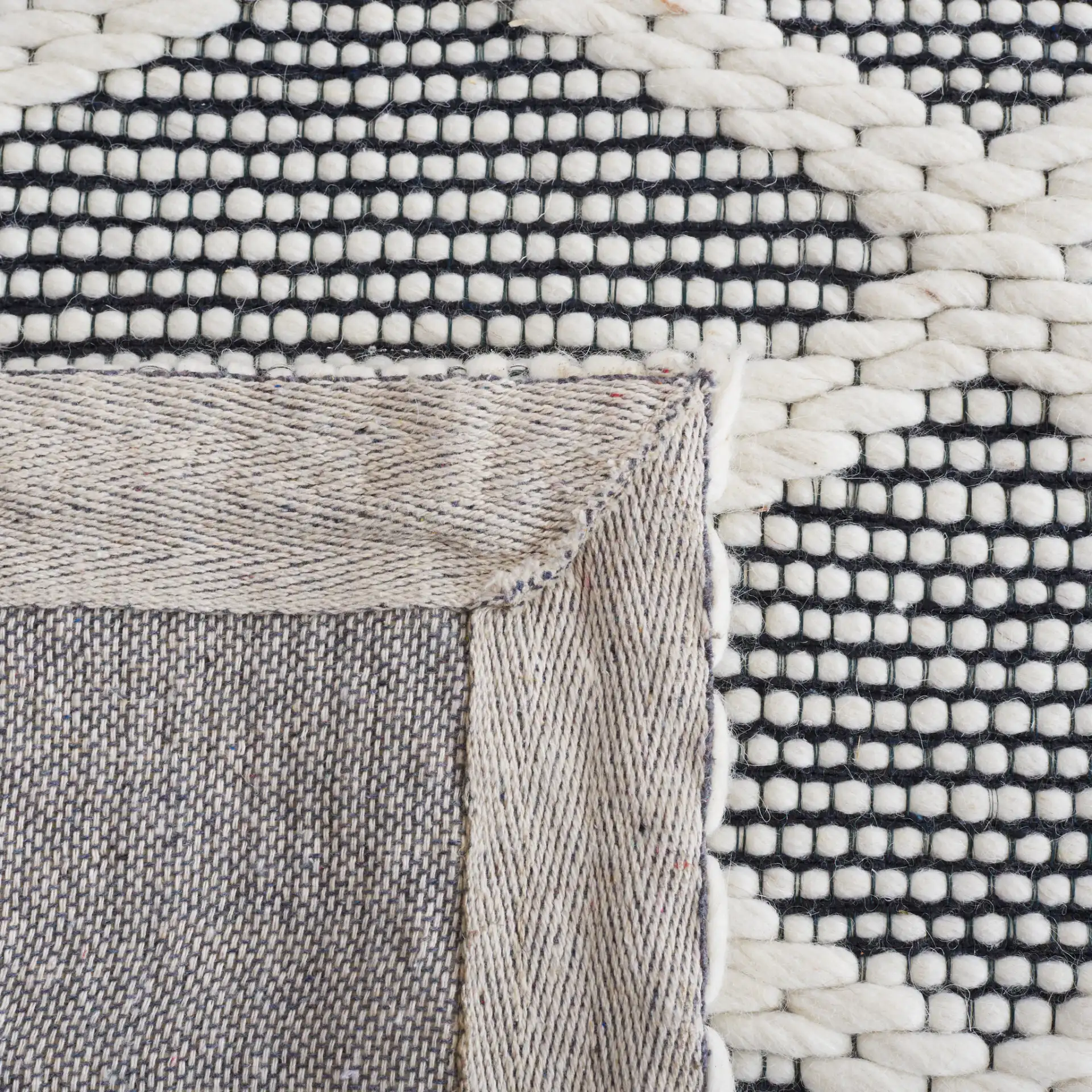Vermont Lattice Band Hand-Woven Wool Rug in Ivory / Black in a styled room