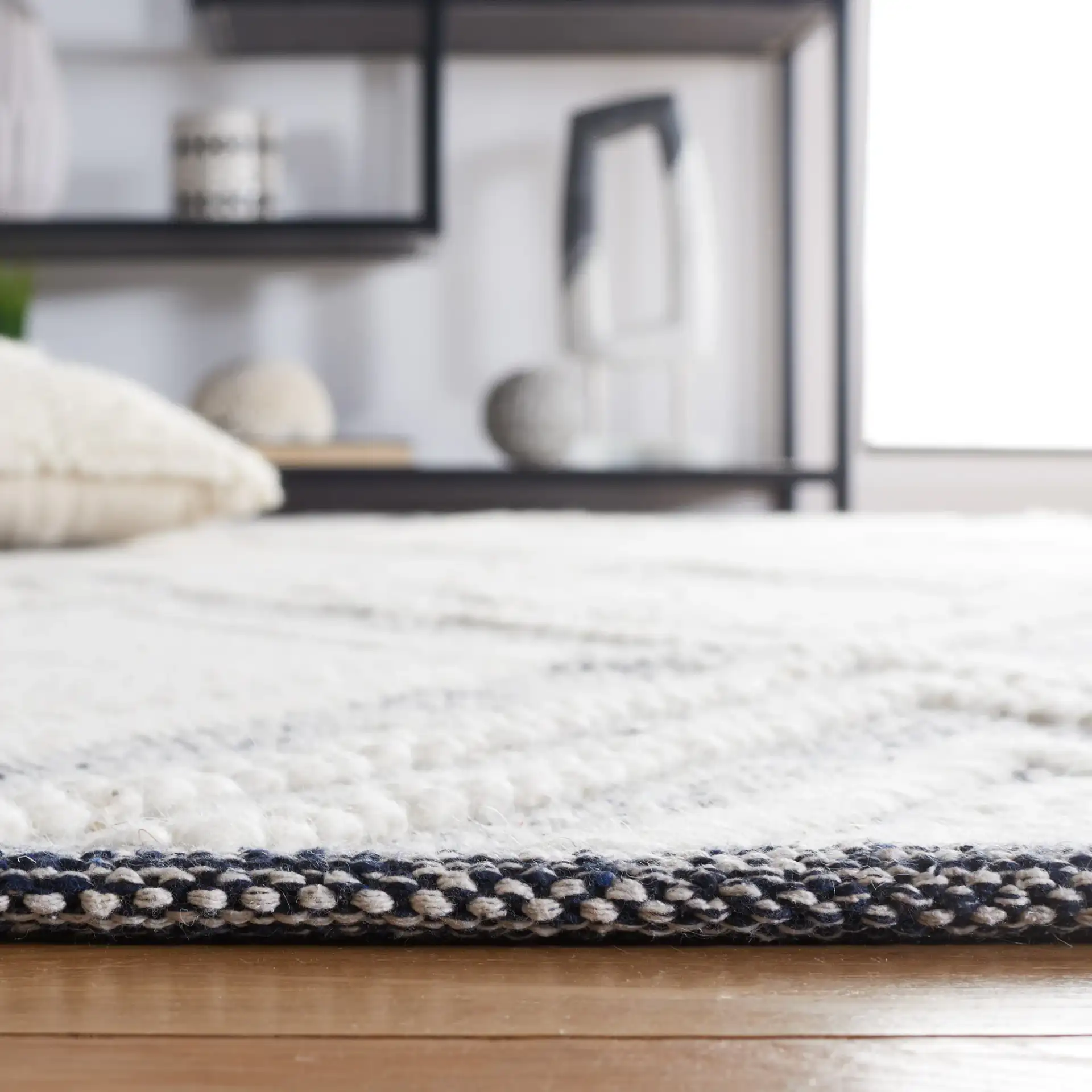 Vermont Nested Diamond Hand-Woven Wool Rug in Ivory / Navy in a styled room