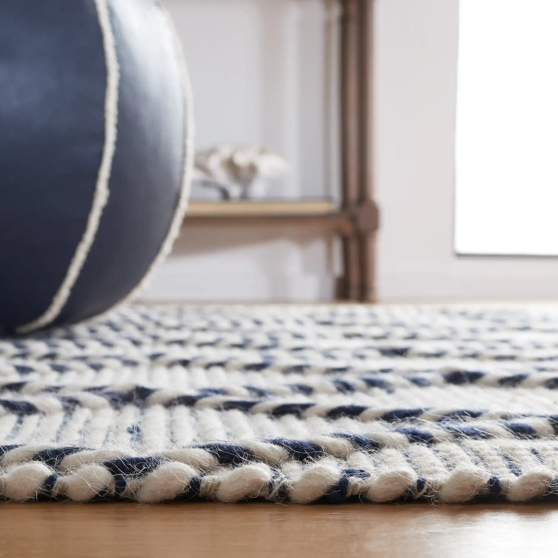 Vermont Moroccan Diamond Hand-Woven Wool Rug in Ivory / Navy in a styled room