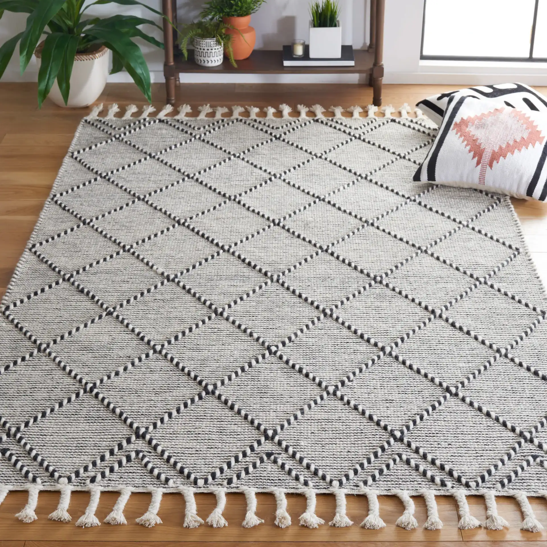 Vermont Thin Diamond Trellis Hand-Woven Wool Rug in Ivory / Black in a styled room