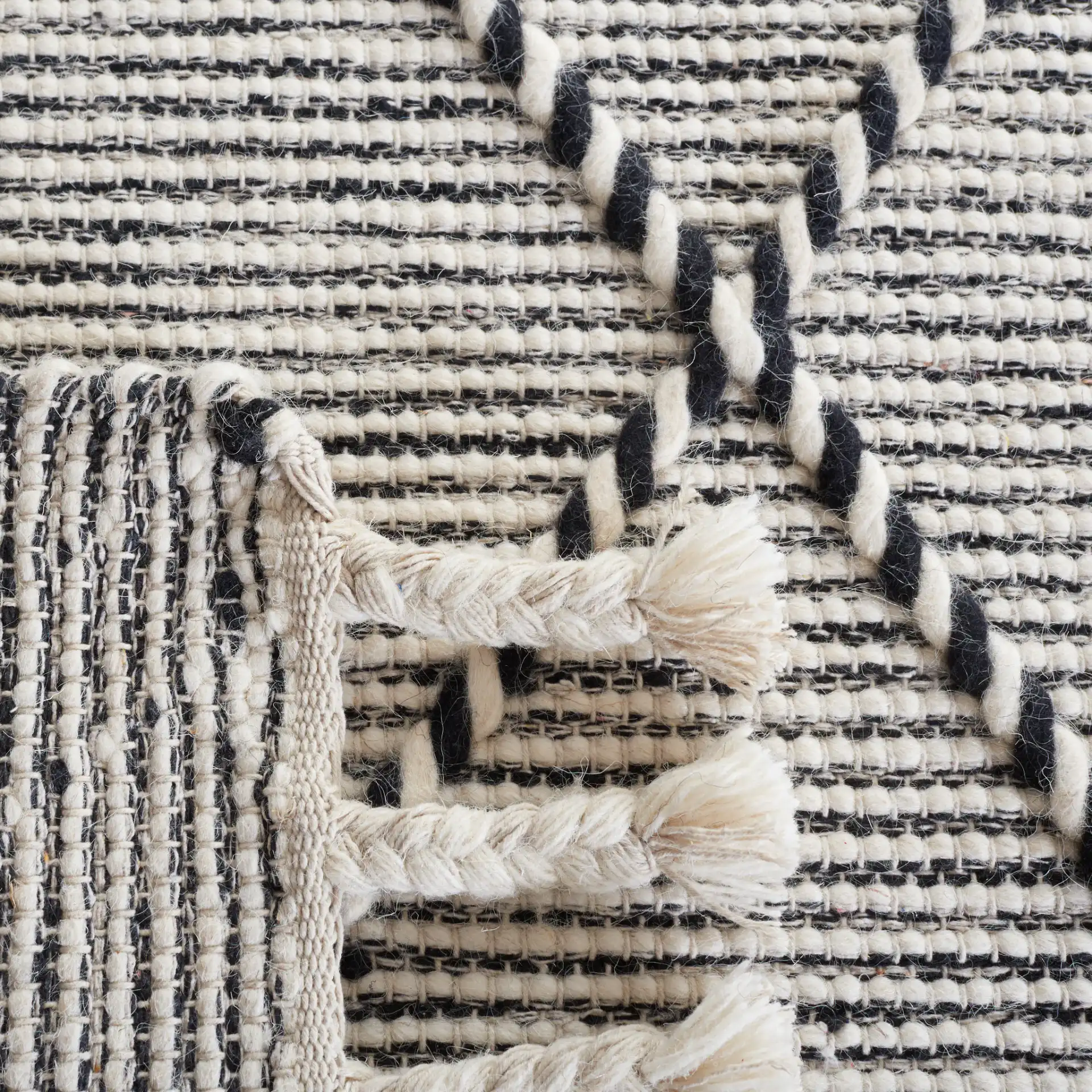 Vermont Thin Diamond Trellis Hand-Woven Wool Rug in Ivory / Black in a styled room