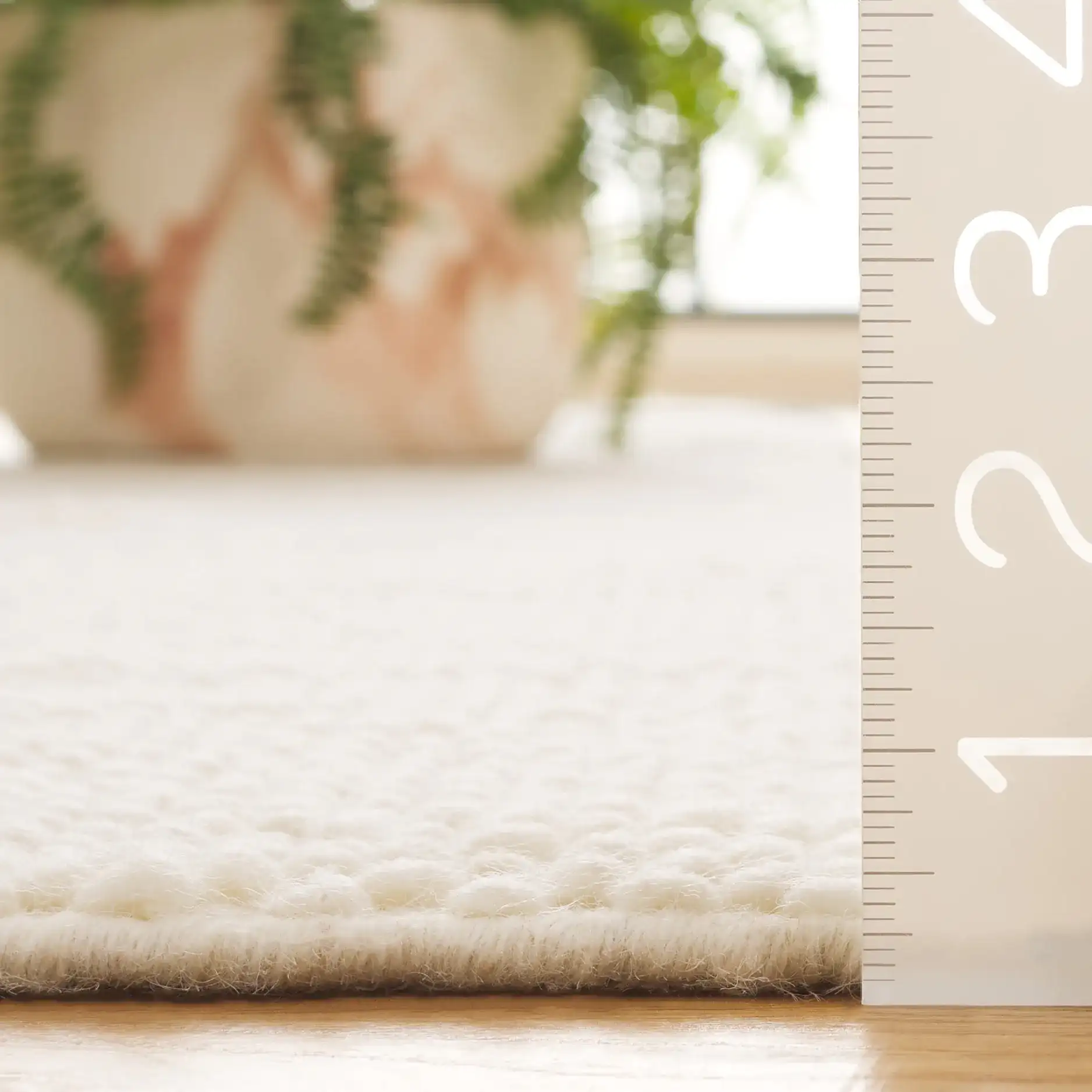Vermont Abstract Wave Hand-Woven Wool Rug in Ivory in a styled room