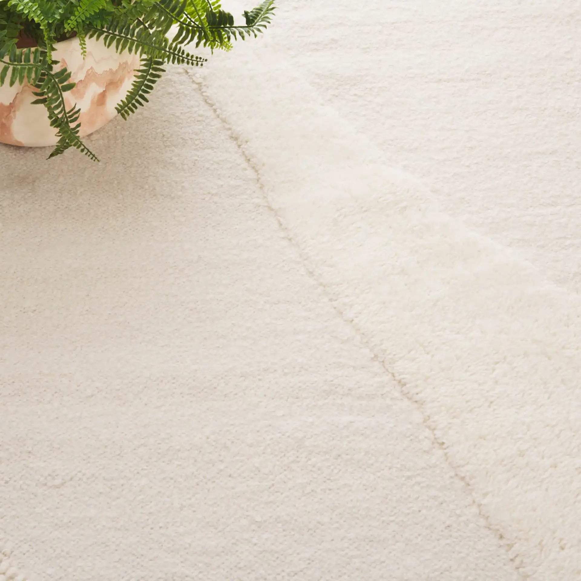 Vermont Abstract Wave Hand-Woven Wool Rug in Ivory in a styled room