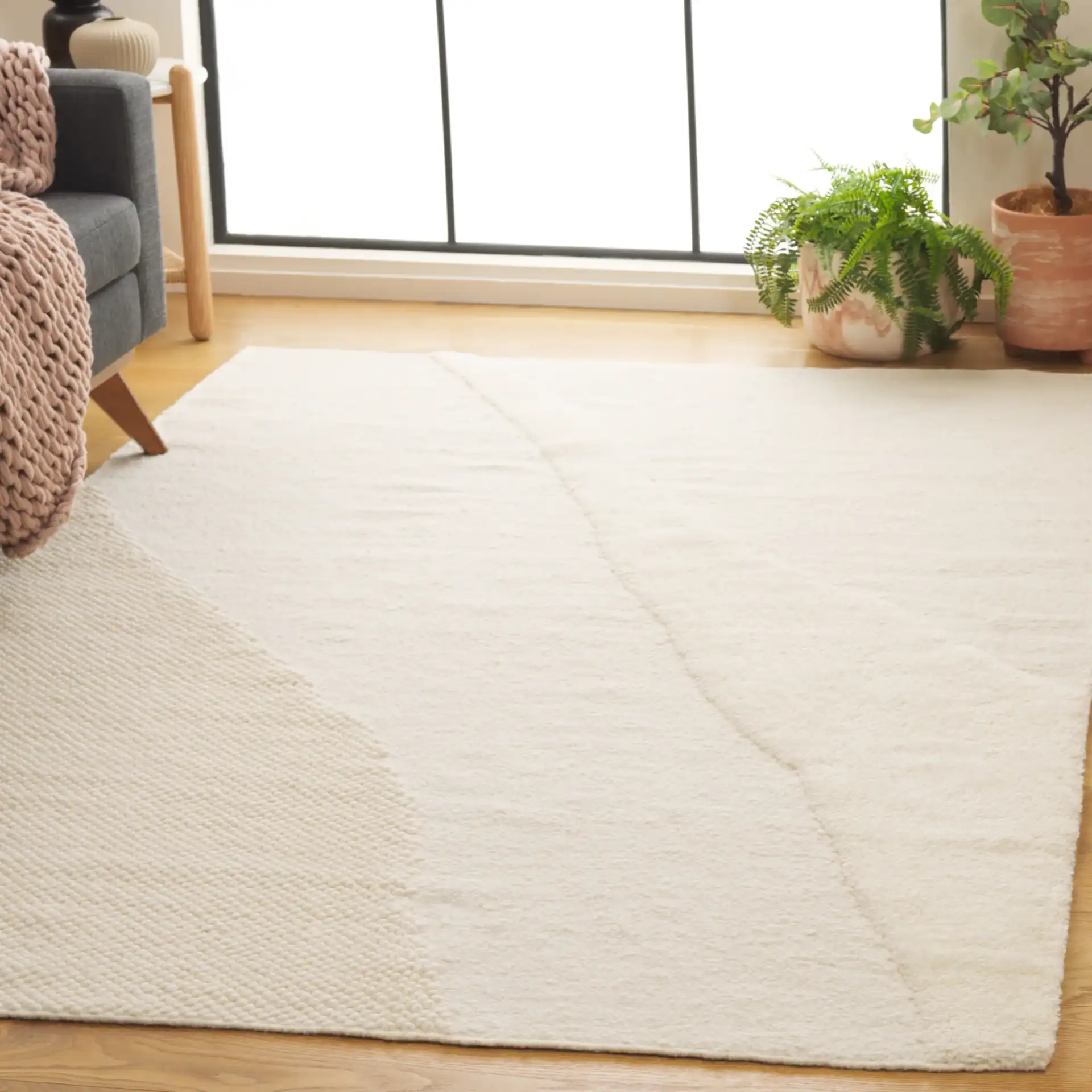 Vermont Abstract Wave Hand-Woven Wool Rug in Ivory in a styled room