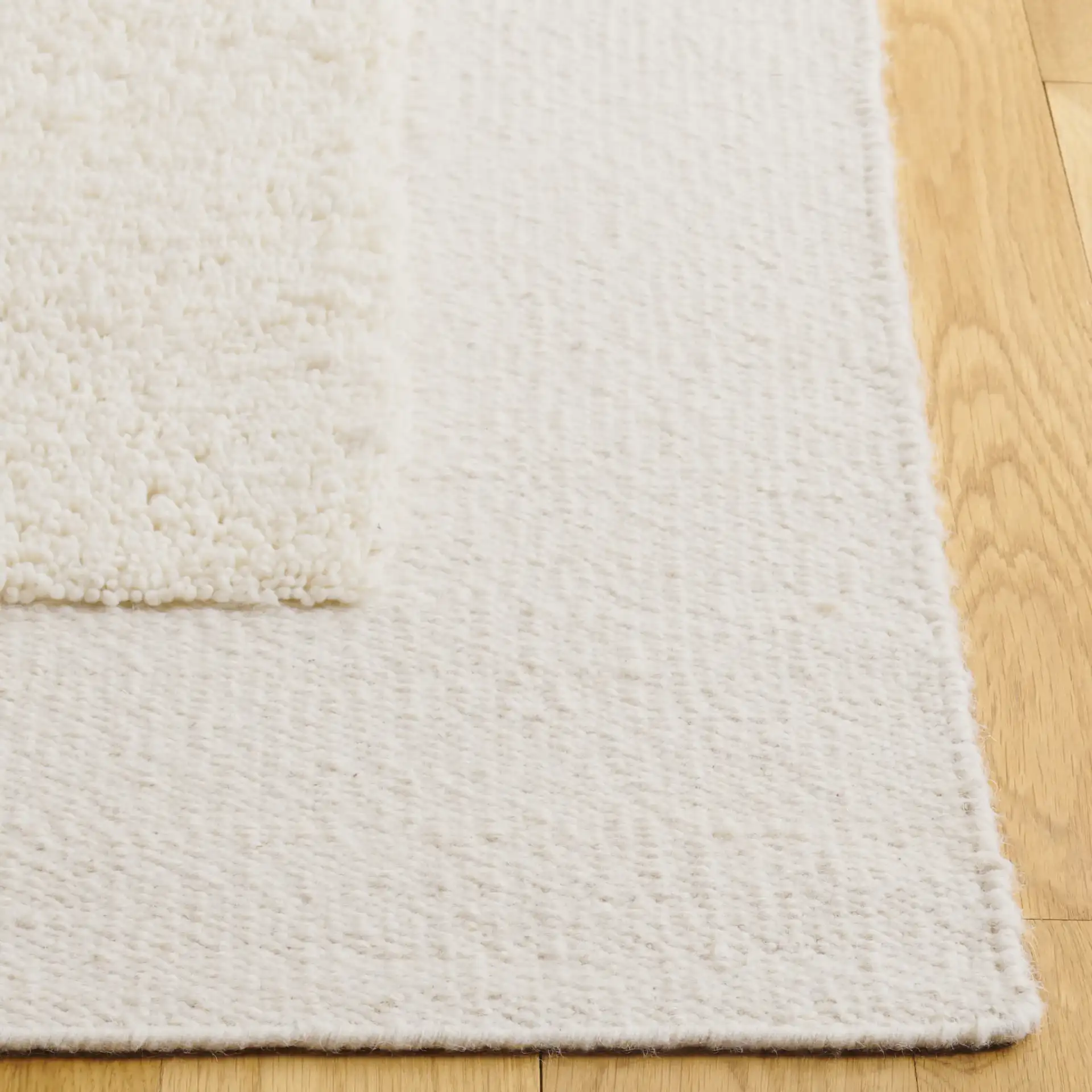 Vermont Color-Block Hand-Woven Wool Rug in Ivory / Beige in a styled room
