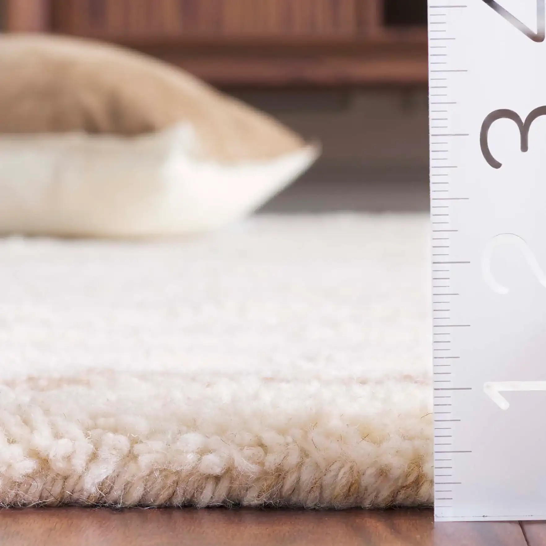 Vermont Scalloped Border Shag Wool Rug in Ivory in a styled room