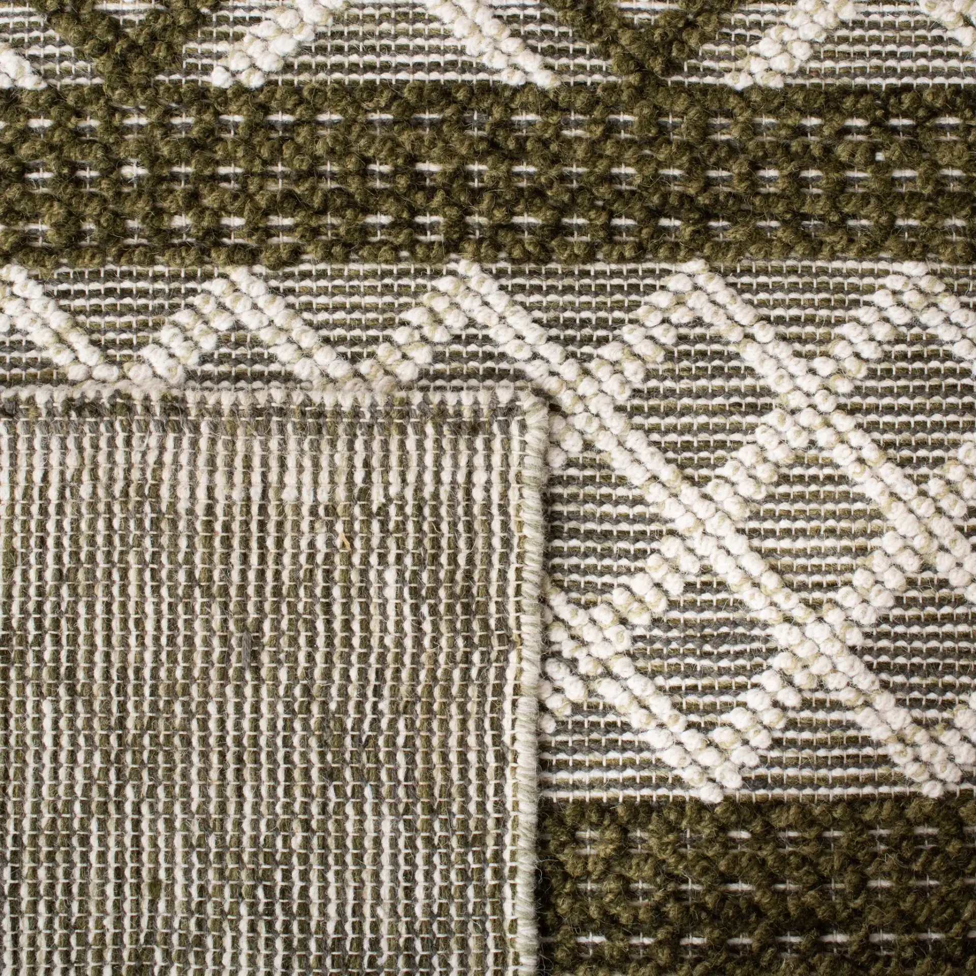 Vermont Banded Diamond Hand-Woven Wool and Cotton Rug in Ivory / Dark Green in a styled room