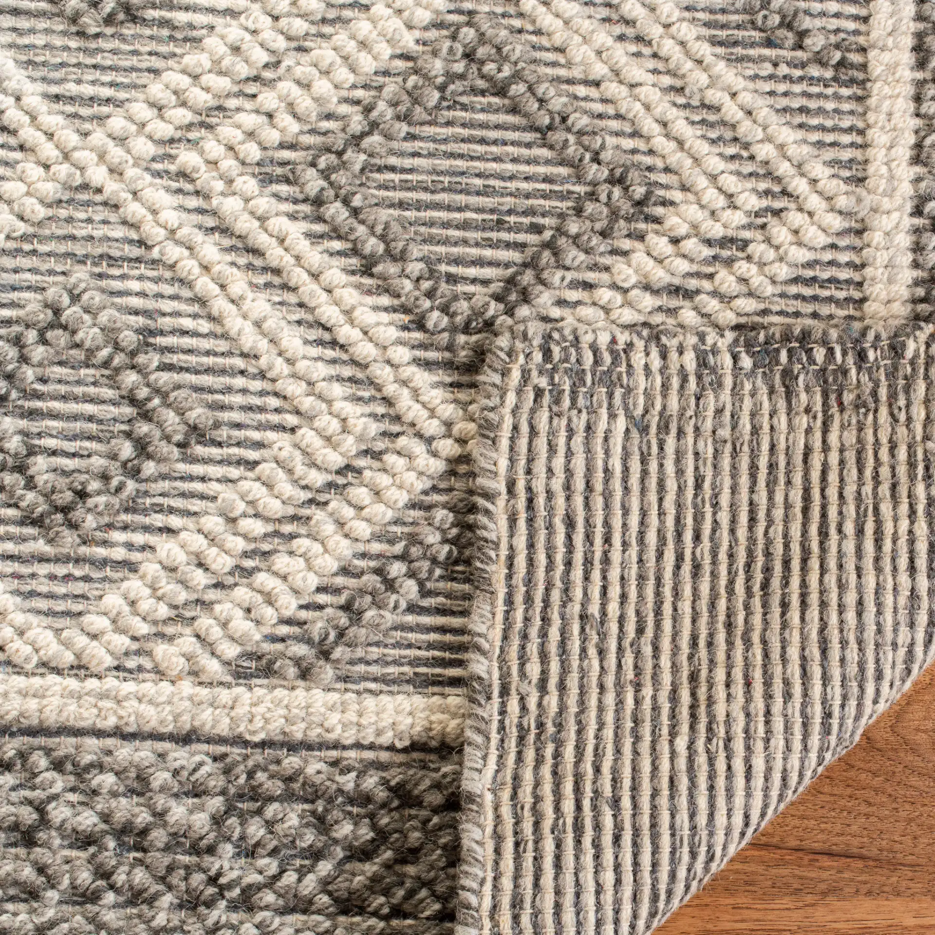 Vermont Diamond Border Hand-Woven Rug in Gray / Ivory in a styled room