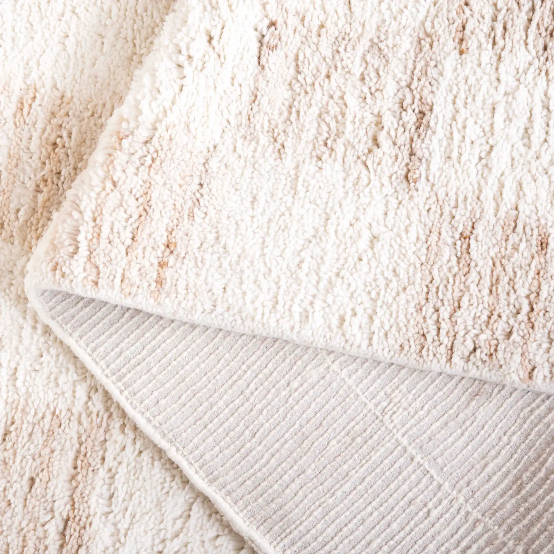 Vermont Checkerboard Hand-Tufted Wool Rug in Beige / Ivory in a styled room