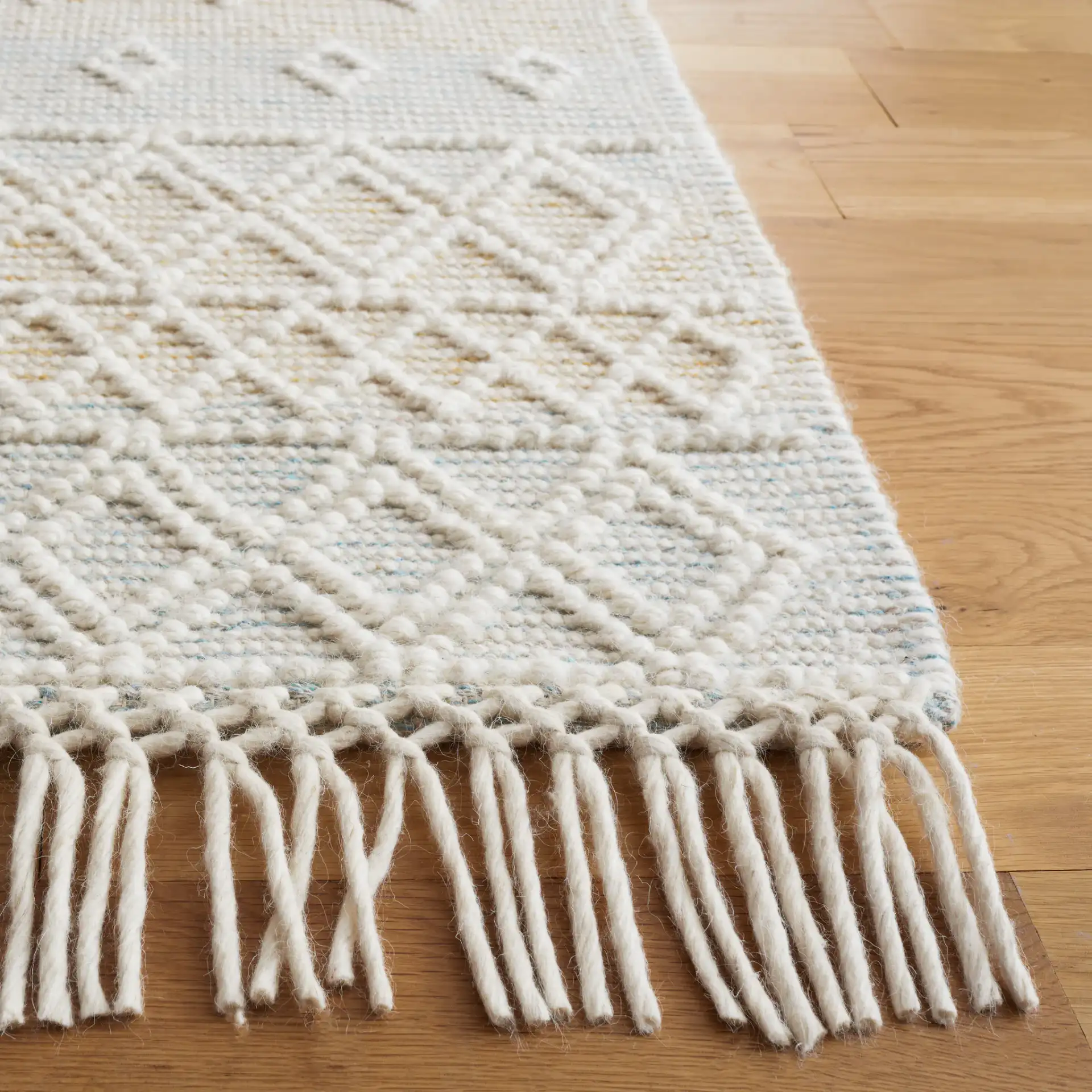 Vermont Fjord Diamond Hand-Loomed Wool Rug in Light Blue / Yellow in a styled room