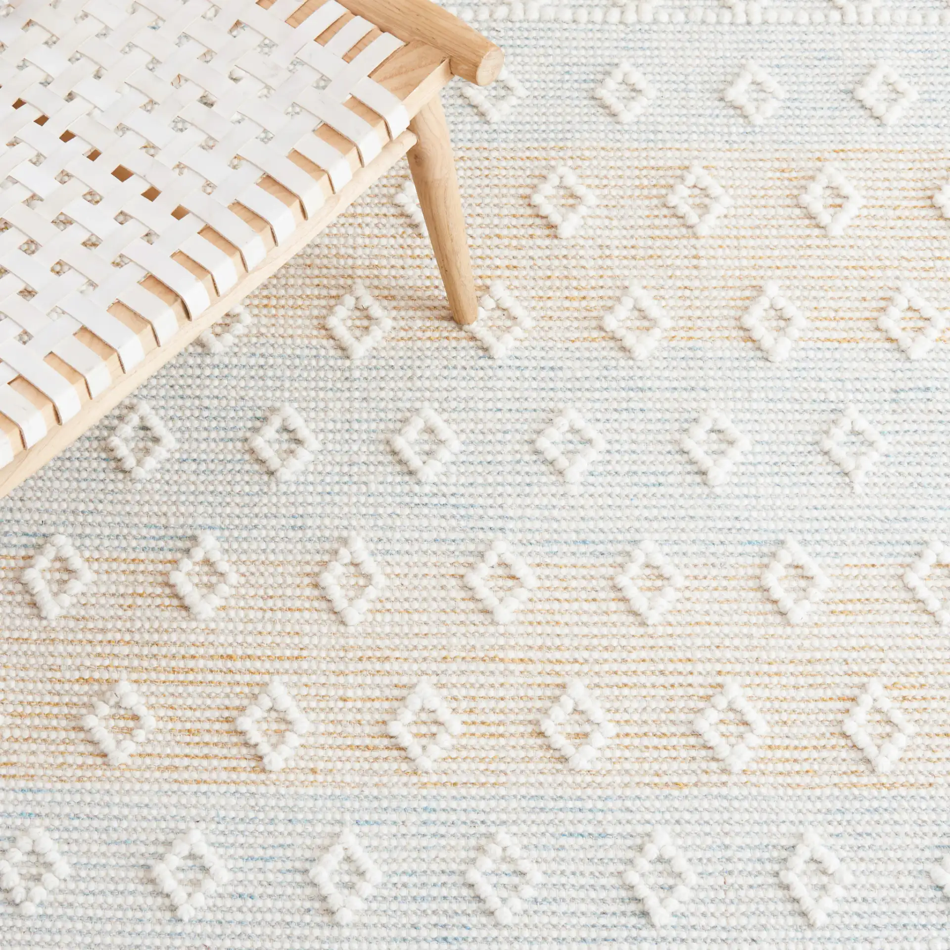 Vermont Fjord Diamond Hand-Loomed Wool Rug in Light Blue / Yellow in a styled room