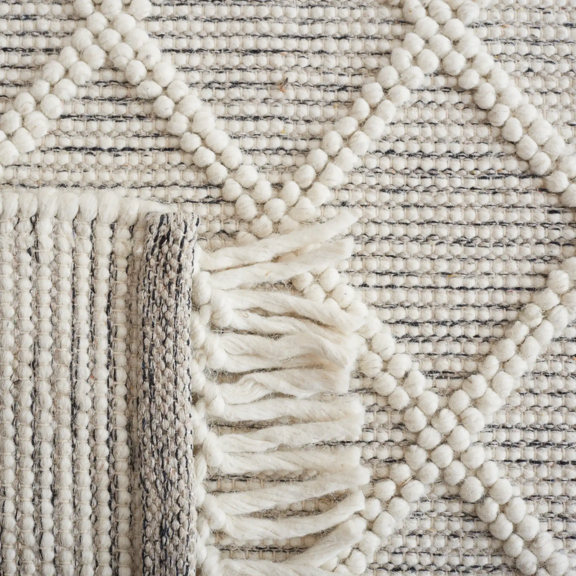 Vermont Banded Diamond Lattice Hand-Loomed Wool Rug in Black / Ivory in a styled room