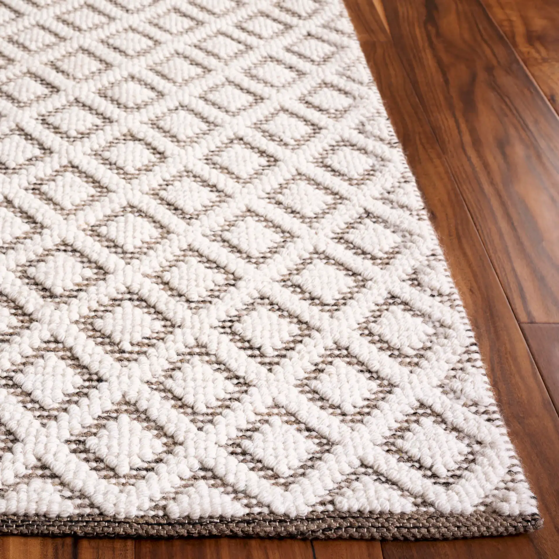 Vermont Diamond Lattice Hand-Woven Wool Rug in Ivory / Brown in a styled room