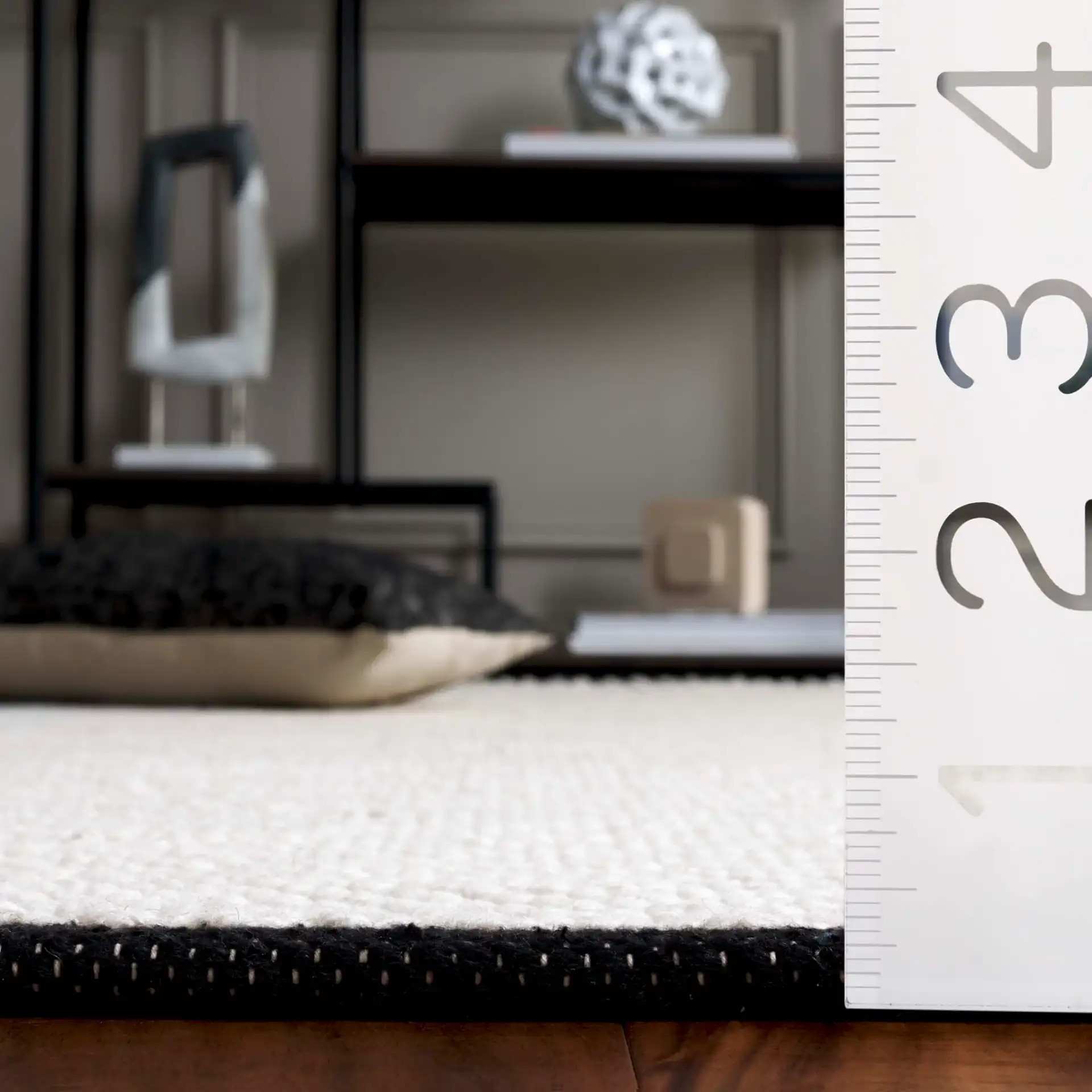 Vermont Micro Nested Diamond Hand-Woven Wool Rug in Ivory / Black in a styled room