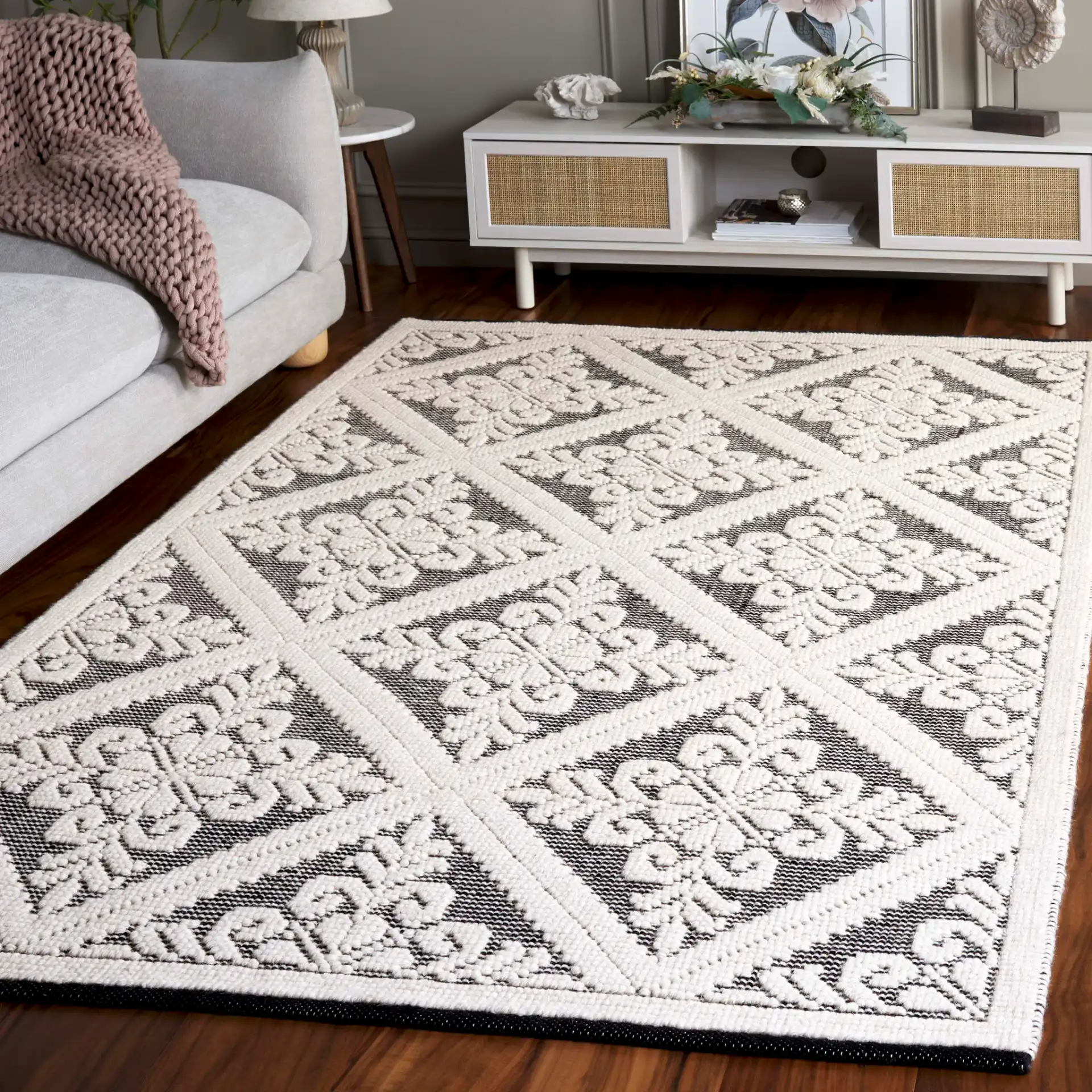 Vermont Floral Diamond Hand-Woven Wool Rug in Ivory / Black in a styled room