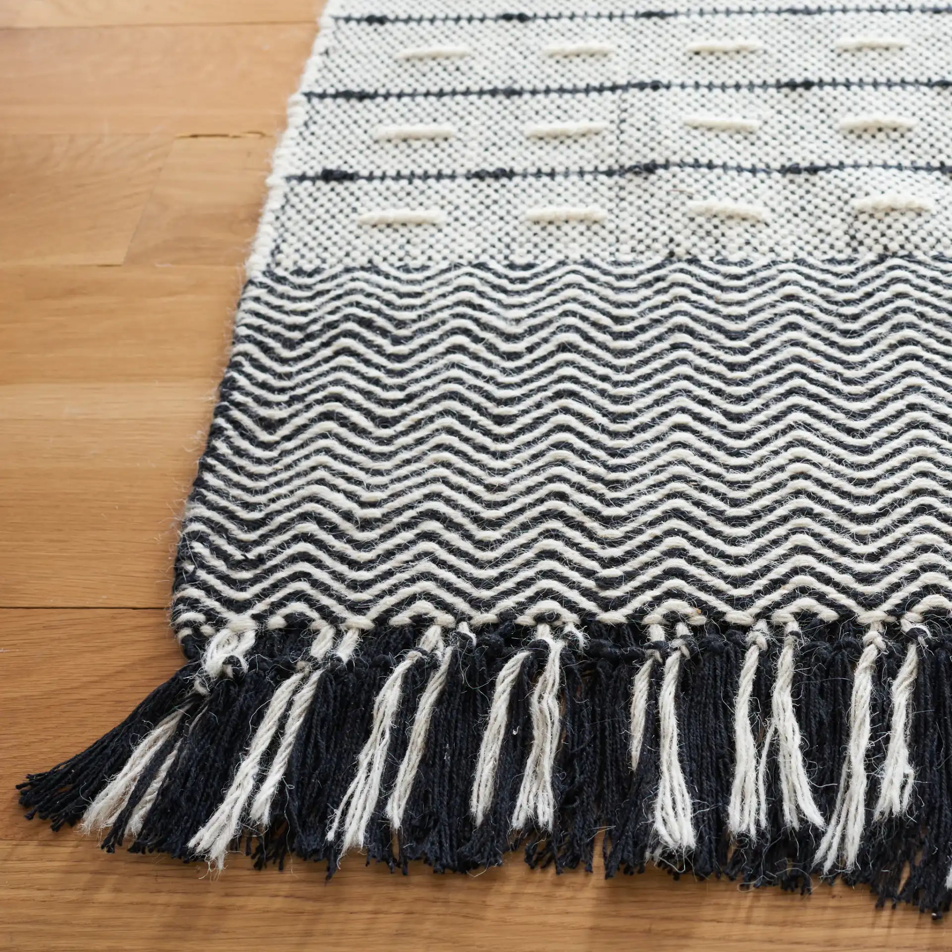 Vermont Dashed Stripe Flatweave Rug in Ivory / Black in a styled room