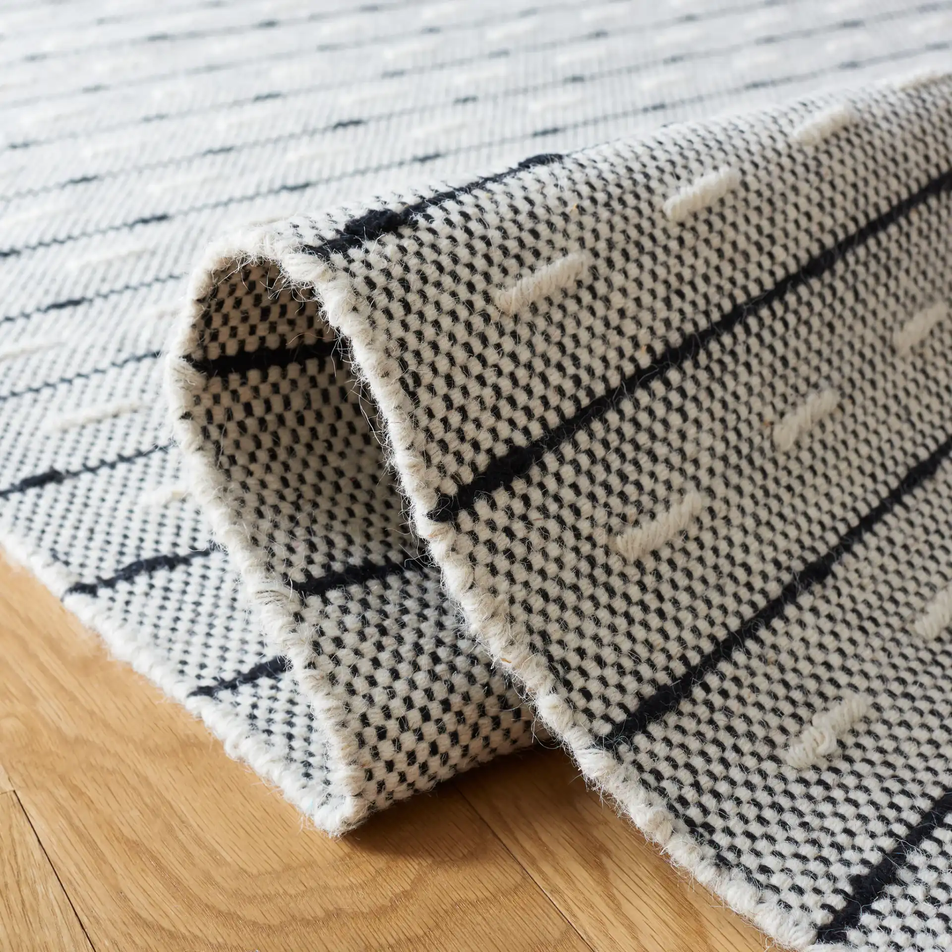 Vermont Dashed Stripe Flatweave Rug in Ivory / Black in a styled room