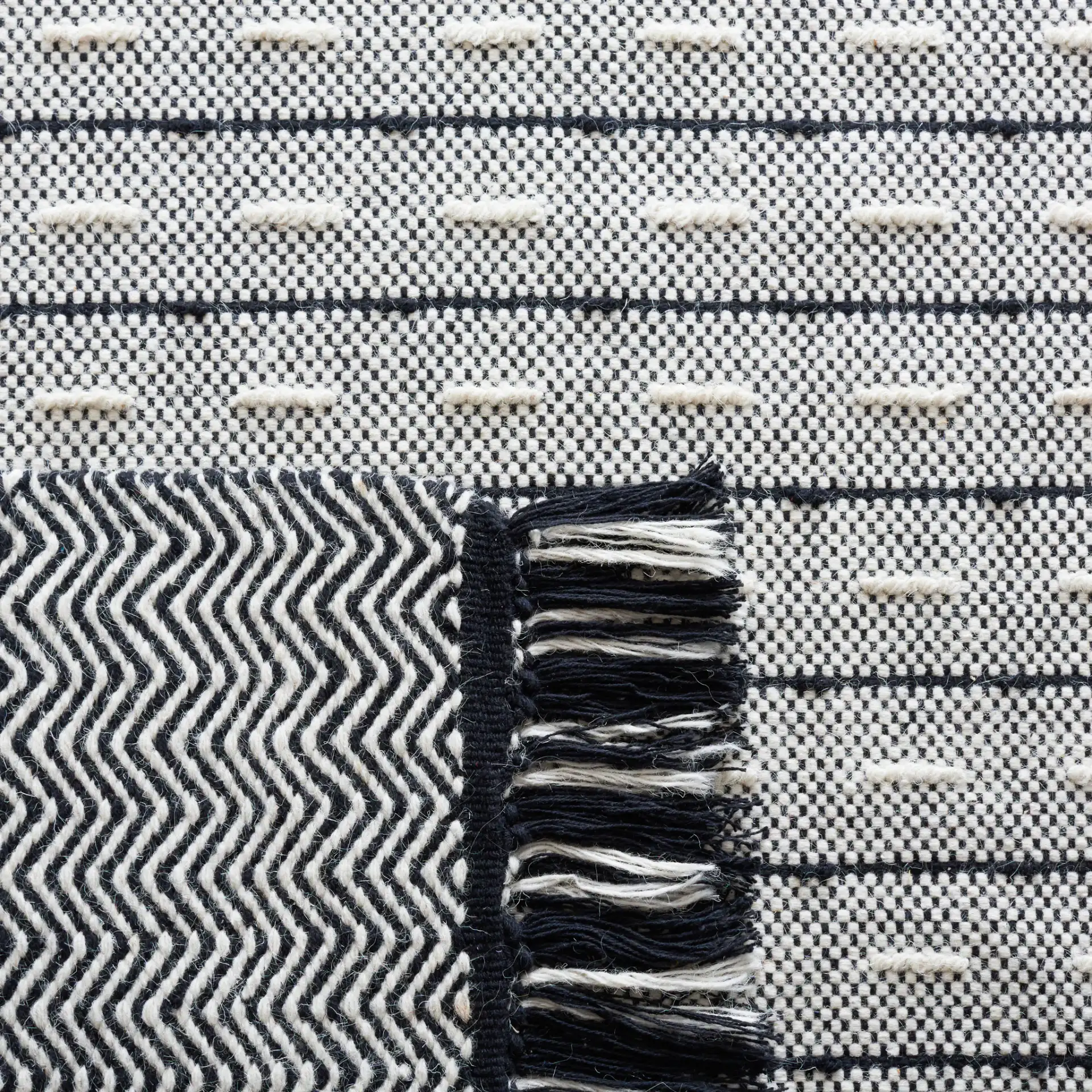 Vermont Dashed Stripe Flatweave Rug in Ivory / Black in a styled room