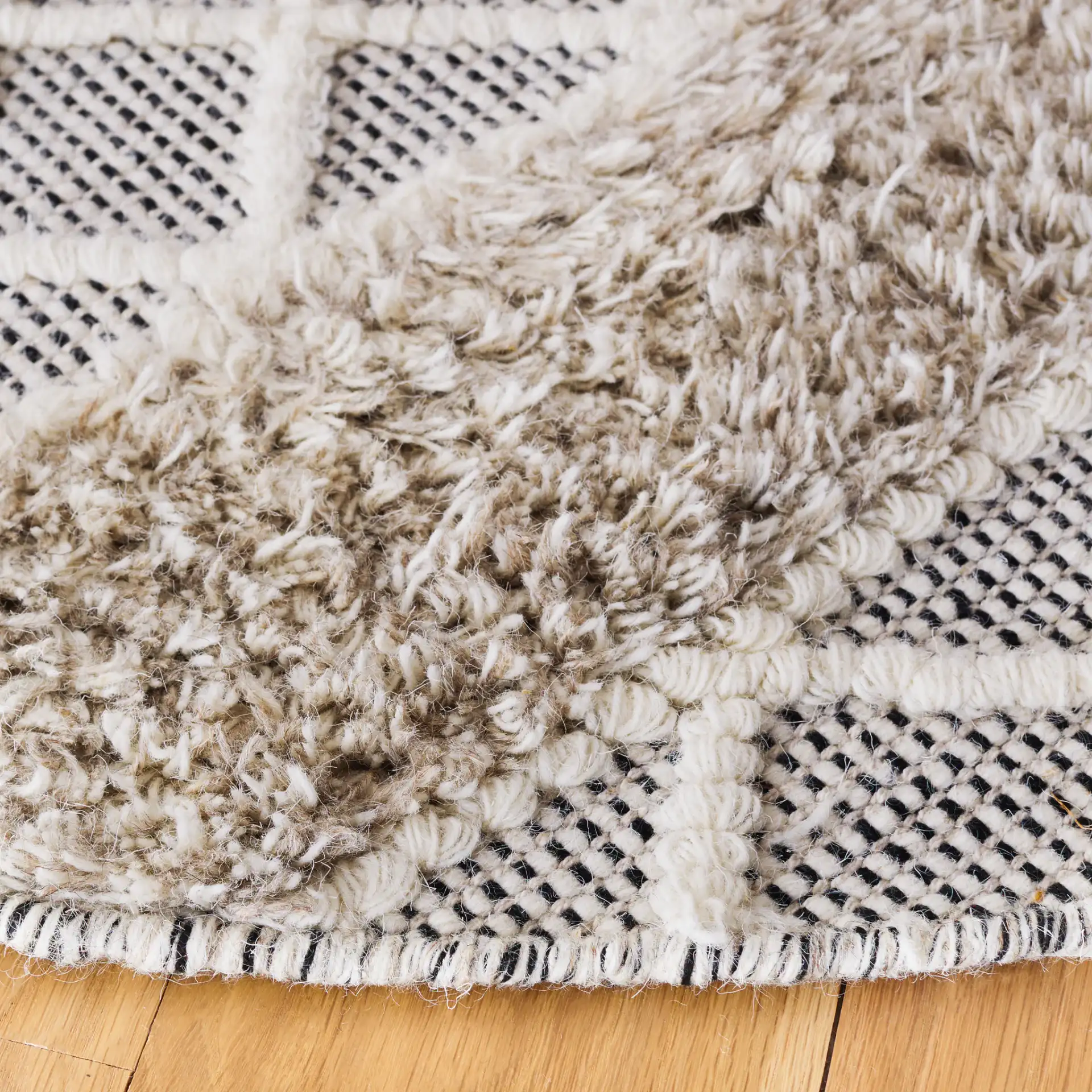 Vermont Banded Diamond Flatweave Wool Rug in Beige / Ivory in a styled room