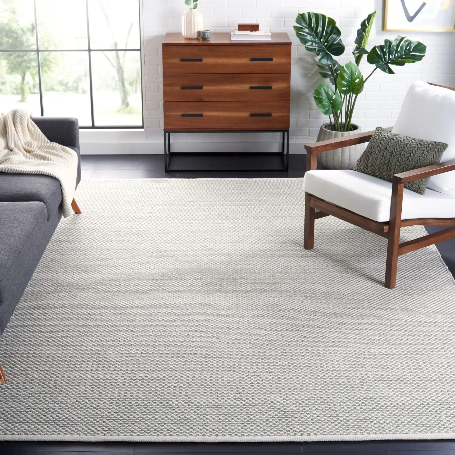 Vermont Textured Flatweave Wool Rug in Green in a styled room