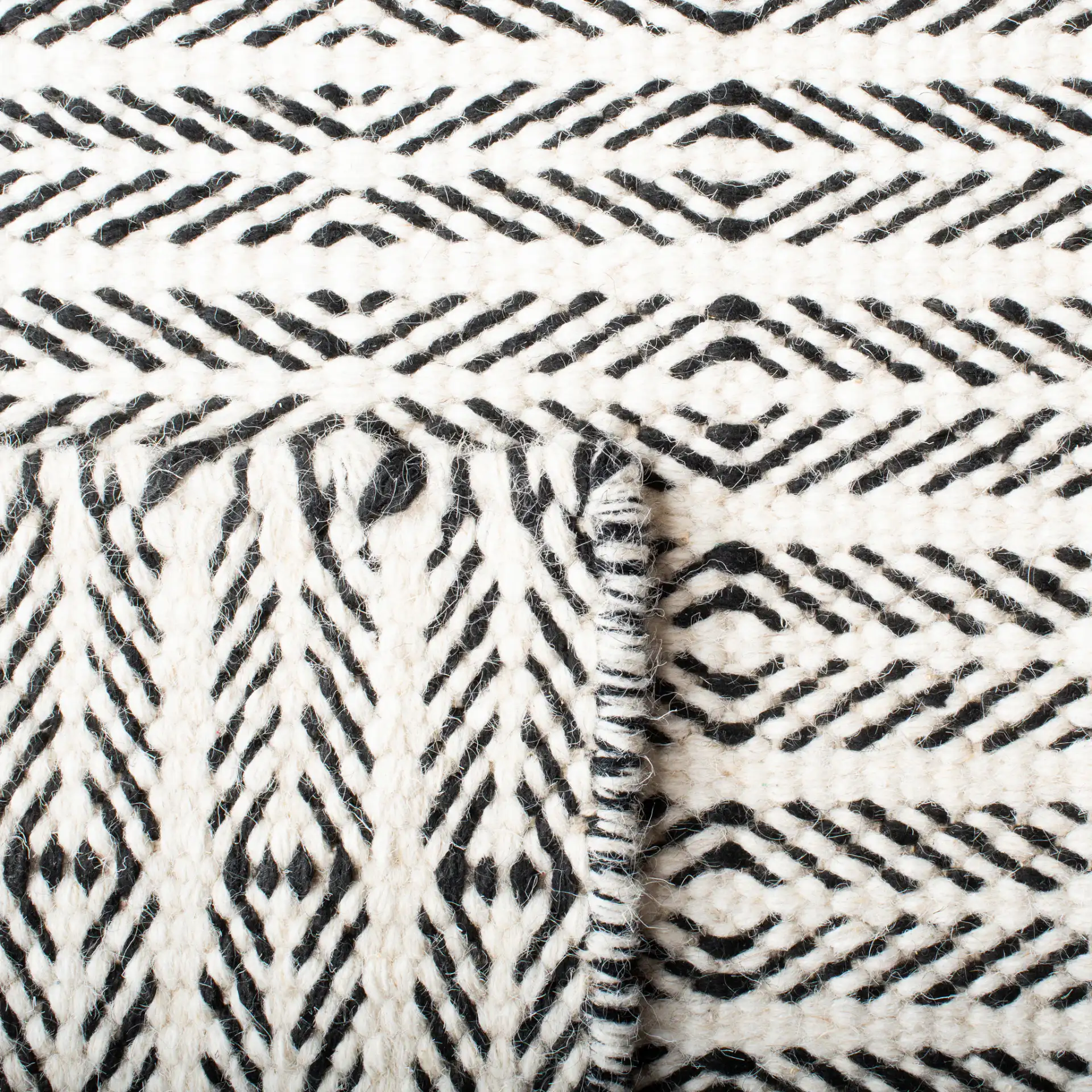Vermont Chevron Hand-Tufted Wool Rug in Black / Ivory in a styled room