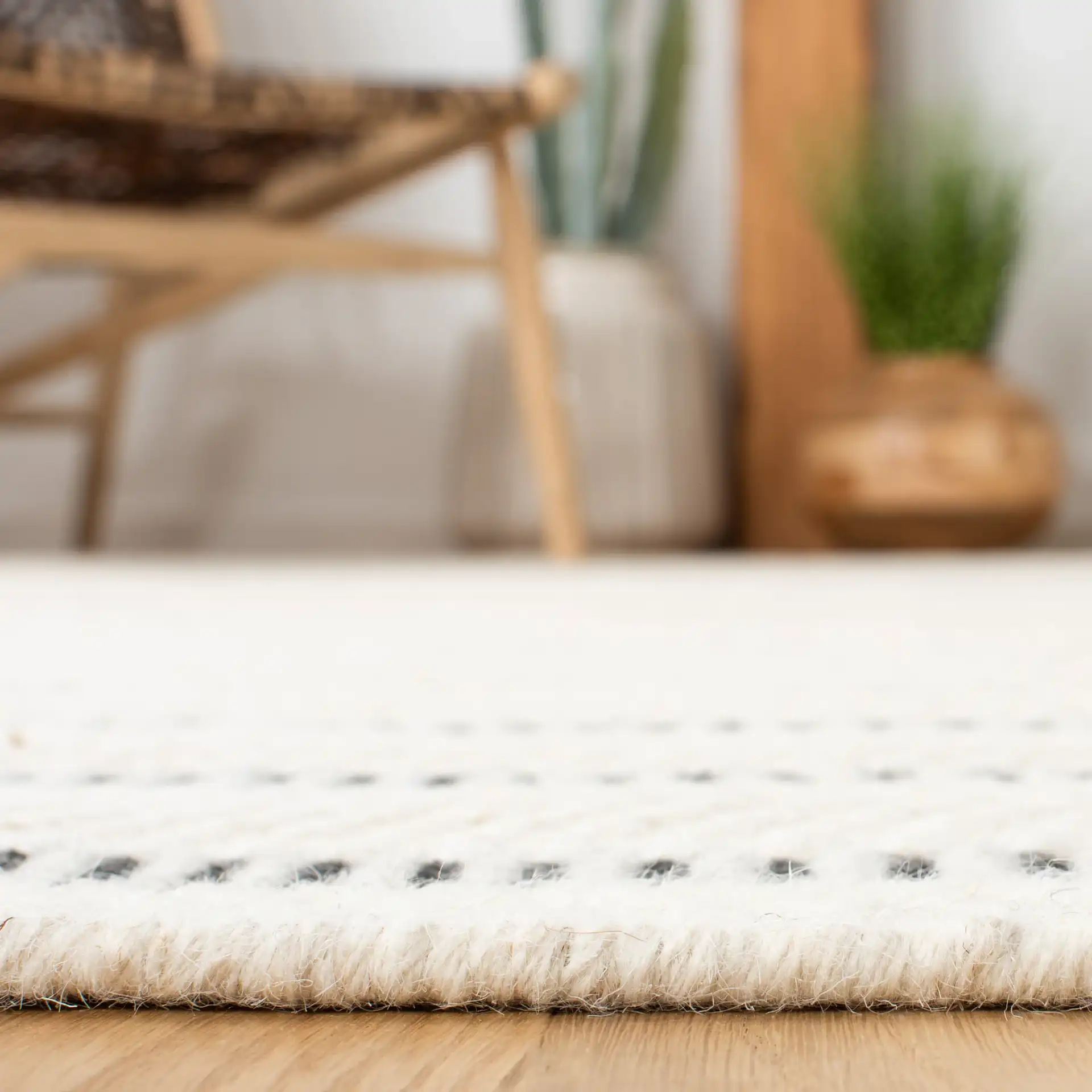 Vermont Stitched Stripe Hand-Tufted Wool Rug in Black / Ivory in a styled room
