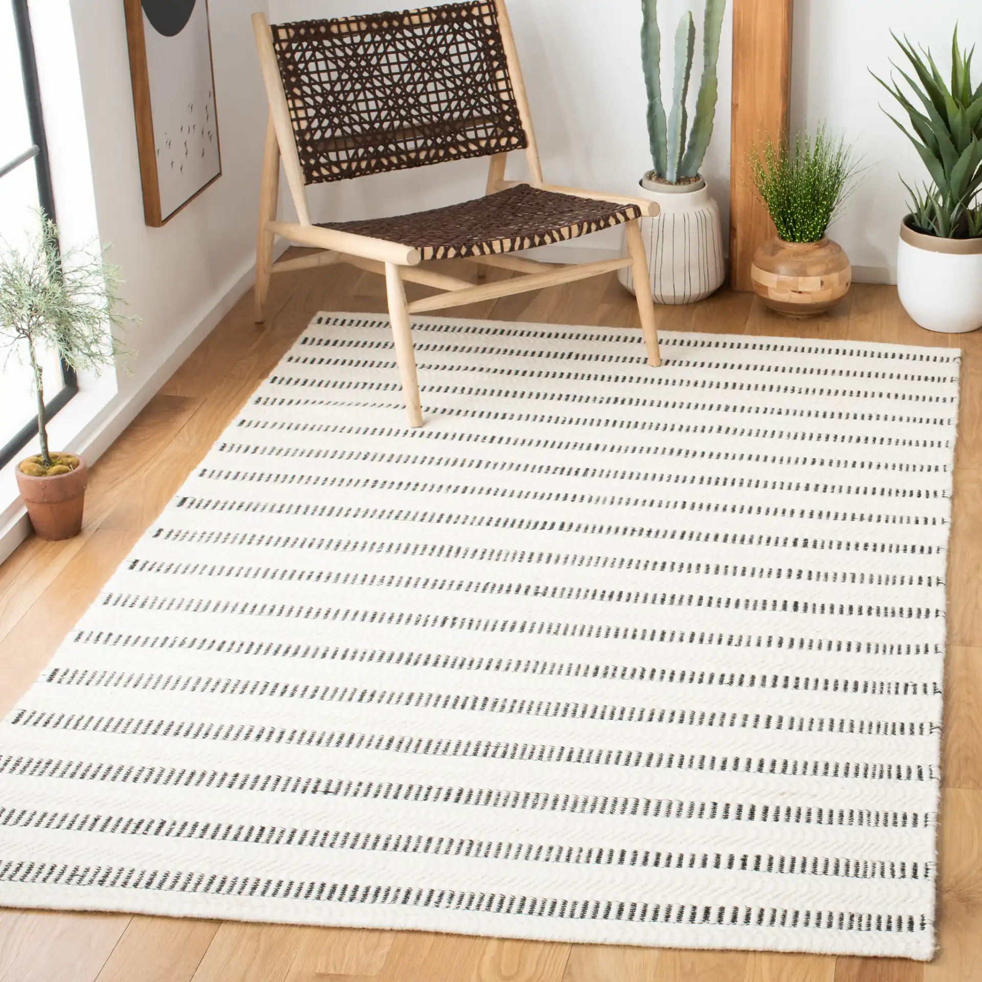 Vermont Stitched Stripe Hand-Tufted Wool Rug in Black / Ivory in a styled room