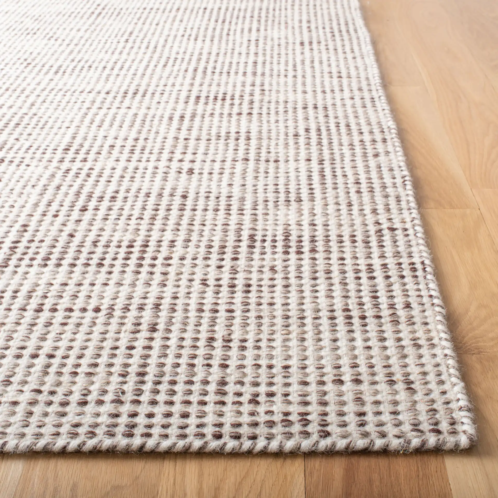 Vermont Textured Grid Hand-Tufted Wool Rug in Brown / Ivory in a styled room