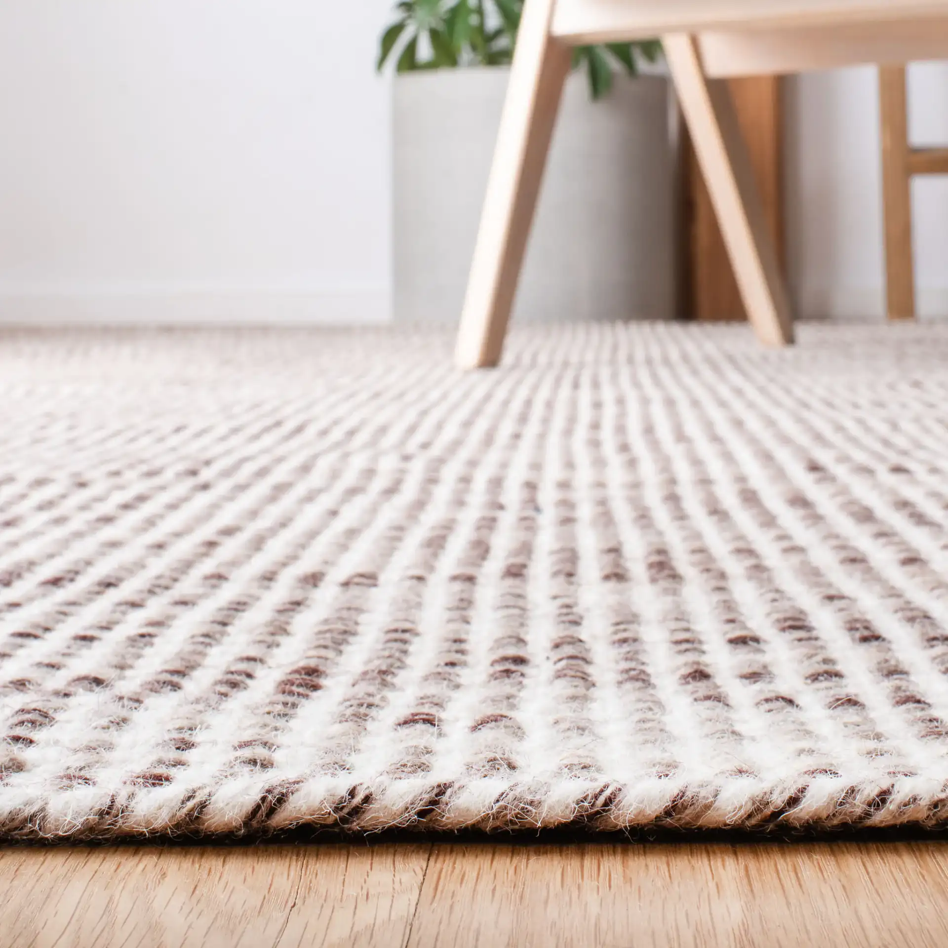 Vermont Textured Grid Hand-Tufted Wool Rug in Brown / Ivory in a styled room