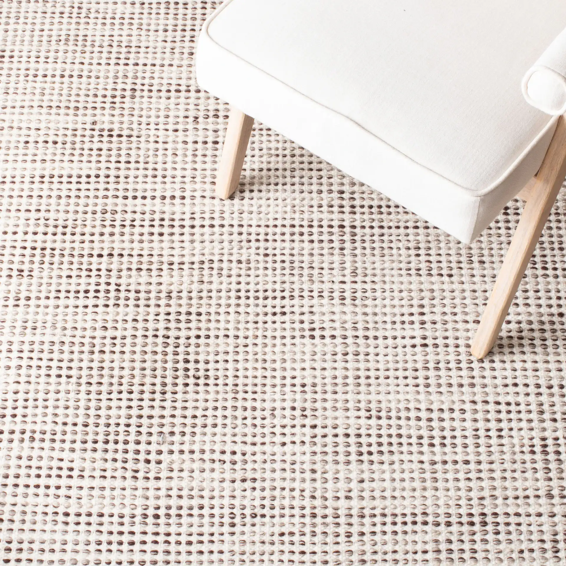 Vermont Textured Grid Hand-Tufted Wool Rug in Brown / Ivory in a styled room