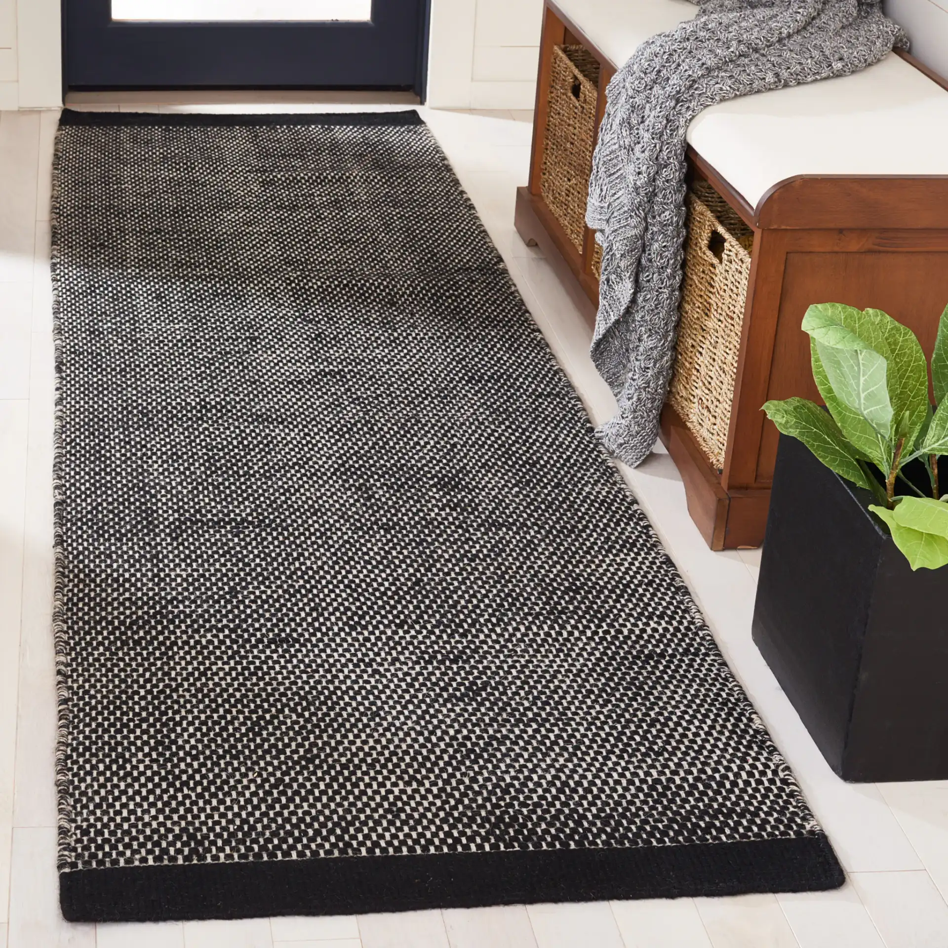 Vermont Basketweave Hand-Woven Wool Rug in Black in a styled room