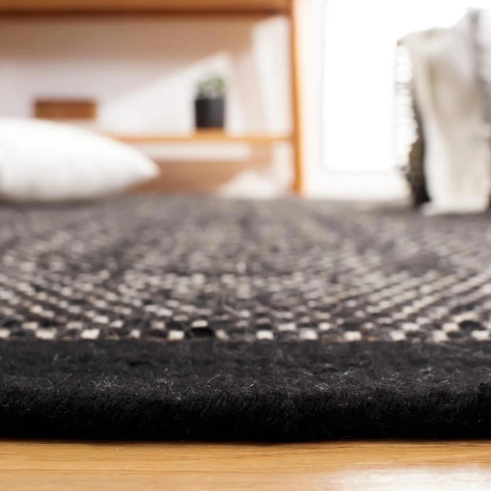 Vermont Basketweave Hand-Woven Wool Rug in Black in a styled room