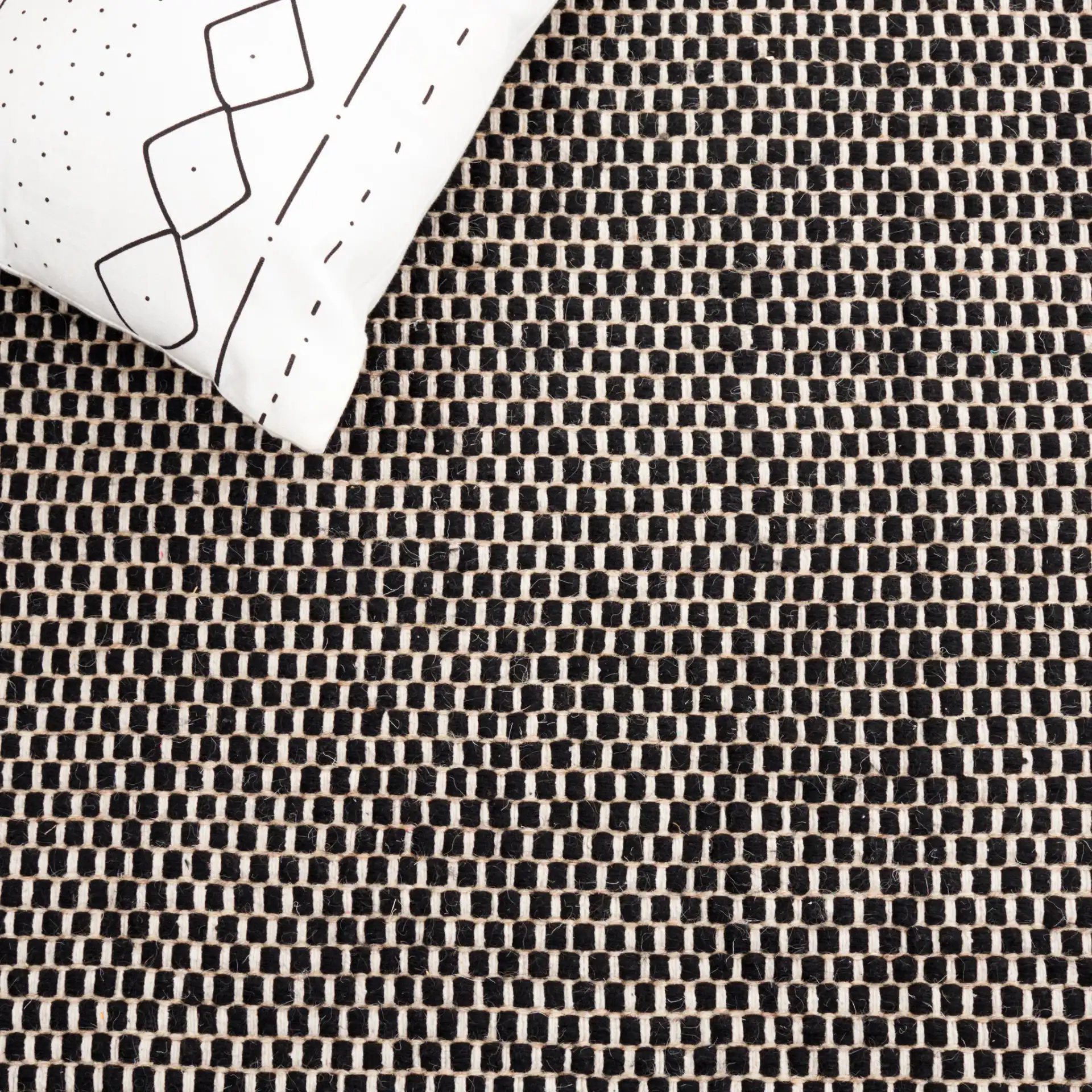 Vermont Basketweave Hand-Woven Wool Rug in Black in a styled room