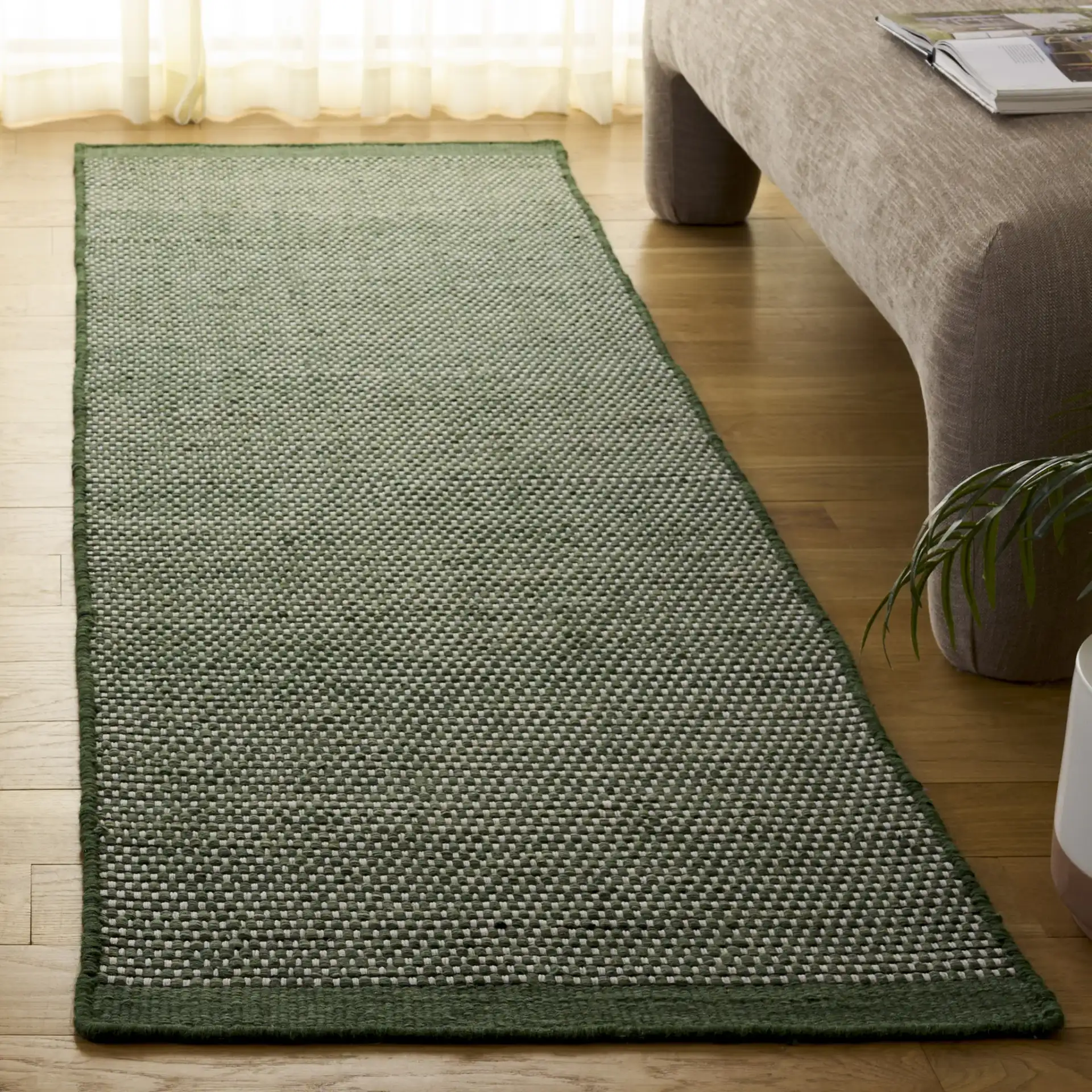 Vermont Ribbed Solid Hand-Woven Wool Rug in Green in a styled room