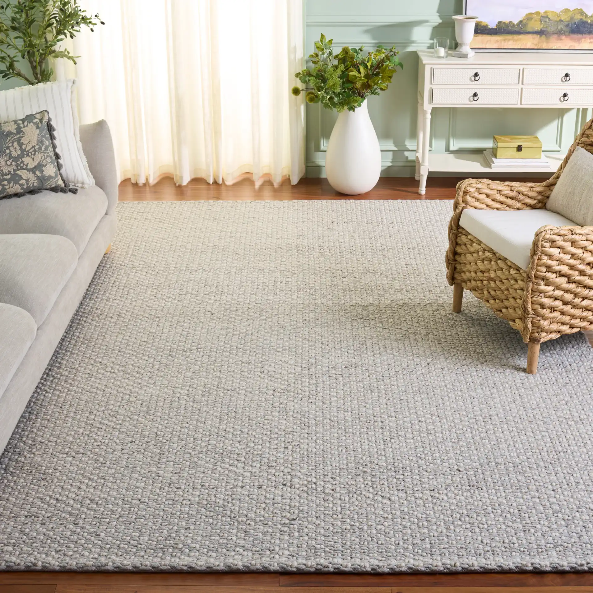 Vermont Pebbled Solid Hand-Woven Rug in Silver / Ivory in a styled room
